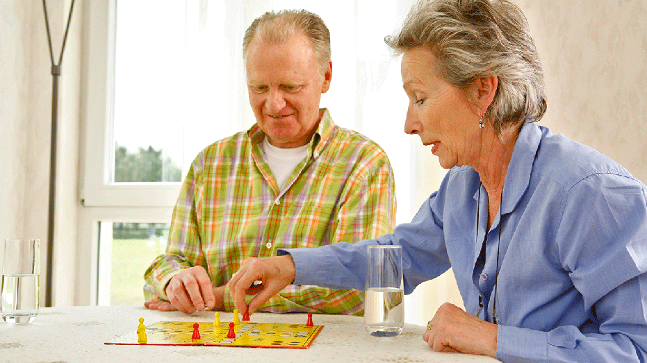 An older couple playing a game