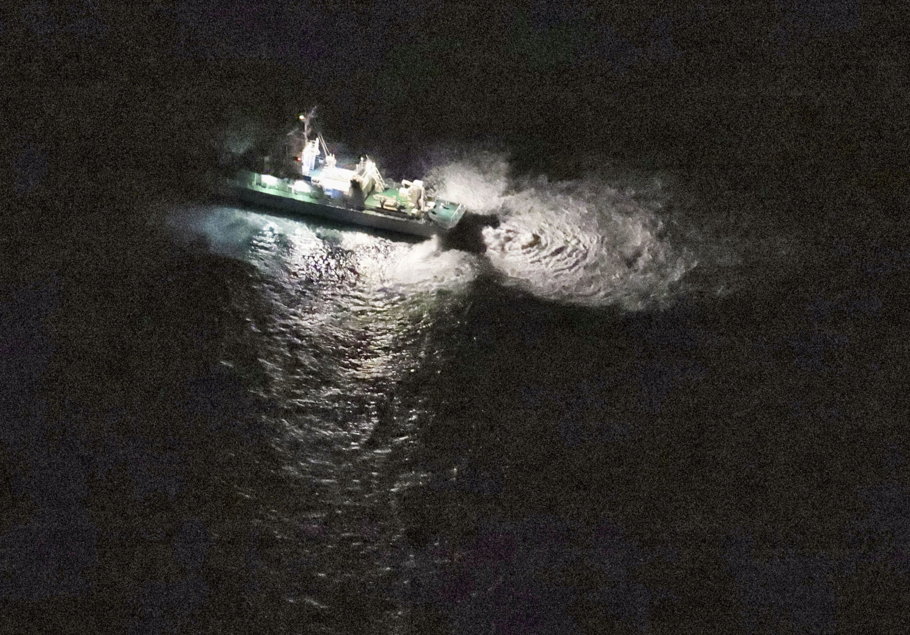PHOTO: A Japan Coast Guard vessel conducts search and rescue operation at the site where a U.S. military aircraft MV-22 Osprey crashed into the sea off Yakushima Island, Kagoshima prefecture, western Japan Nov. 29, 2023, in this photo taken by Kyodo.