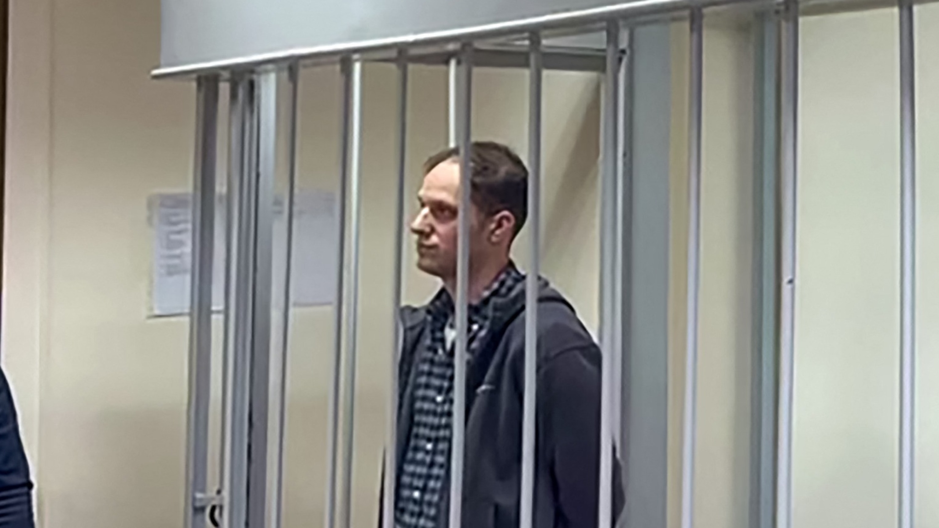 PHOTO: This grab from a handout footage provided by the Lefortovsky Court on Nov. 28, 2023, shows journalist Evan Gershkovich, arrested on espionage charges, standing inside a defendants' cage.