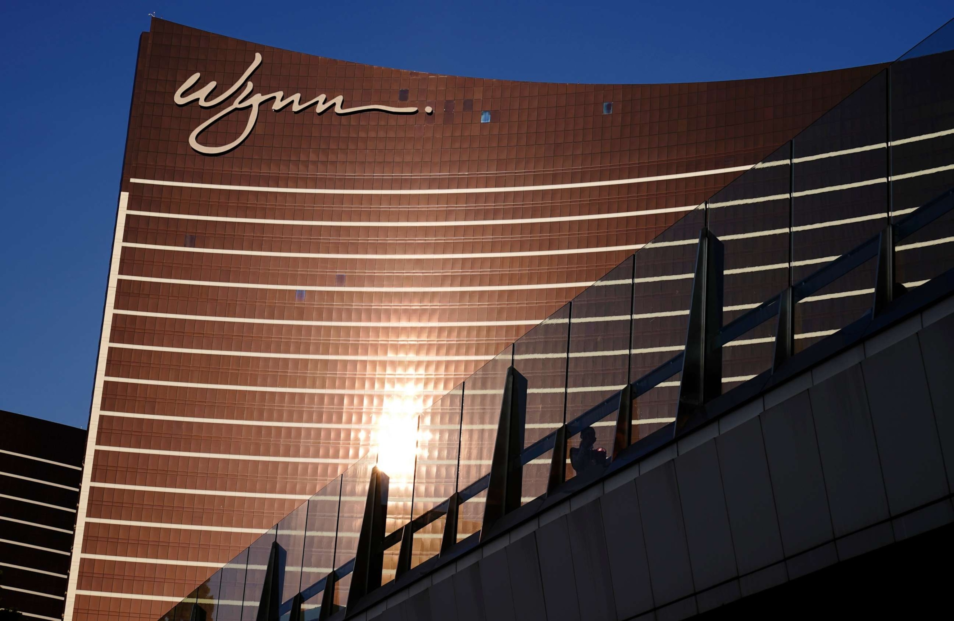 PHOTO: People walk along a pedestrian bridge near the Wynn Las Vegas hotel-casino, Sept. 17, 2020, in Las Vegas.