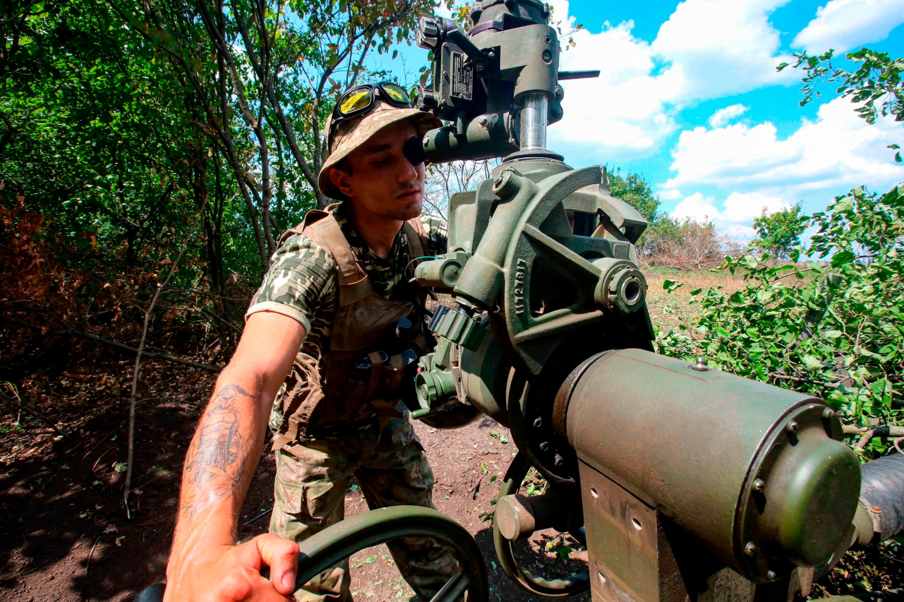 PHOTO: A Ukrainian serviceman adjusts artillery fire, Kharkiv Region, northeastern Ukraine, July 28, 2022.