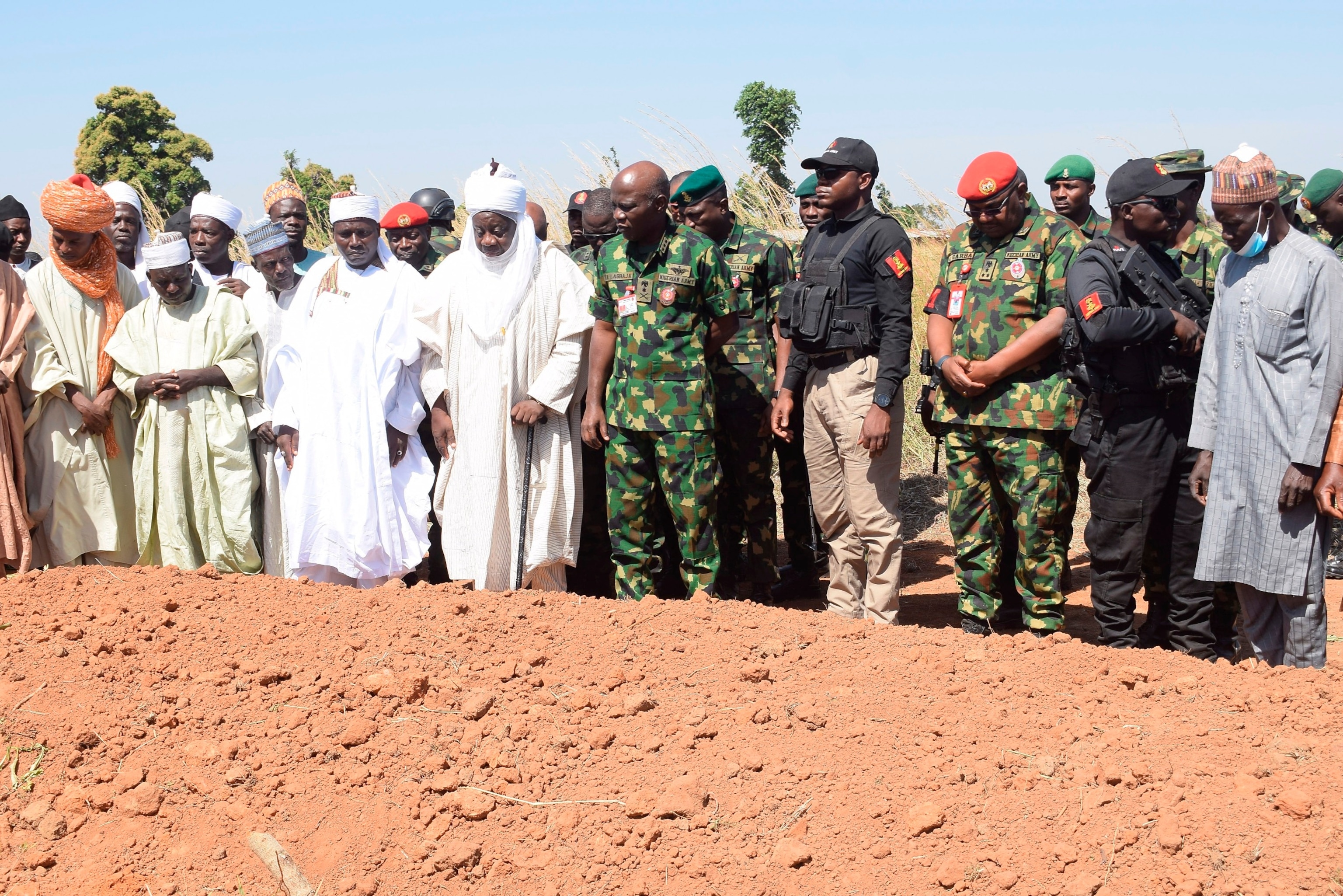 PHOTO: Nigeria Chief of Army Staff Lieutenant General Taoreed Lagbaja, center, with other Community leaders pray at the grave side were victims of an army drones attack were buried in Tudun Biri village Nigeria, Tuesday, Dec. 5, 2023.