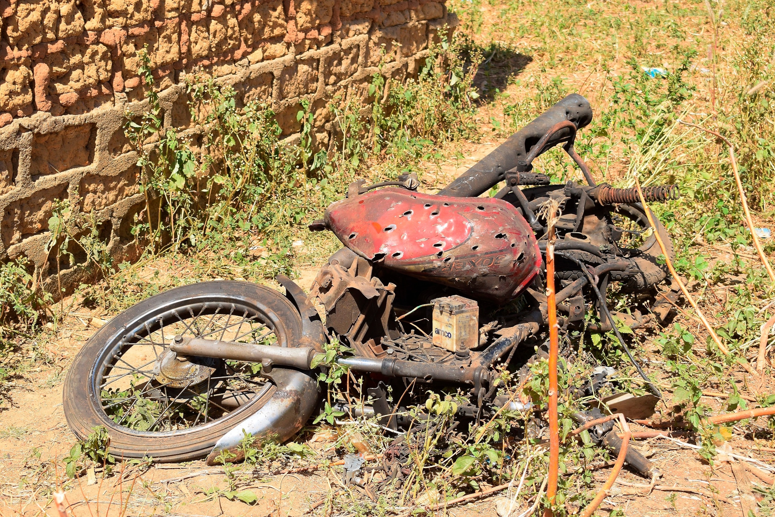 PHOTO: The remain of a motorcycle lie on the ground following an army drone attack at Tudun Biri village Nigeria, Tuesday, Dec. 5, 2023.