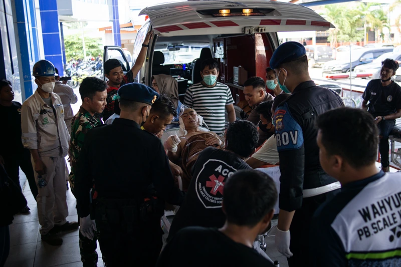 A Chinese worker who was injured in the explosion at a nickel smelter furnace is brought to the Morowali Regional General Hospital in Central Sulawesi on December 24, 2023. At least 13 people were killed and 38 injured in eastern Indonesia on December 24 in an explosion at a Chinese-funded nickel-processing plant, the owner of the industrial park that hosts the facility said. (Photo by AFP) (Photo by STR/AFP via Getty Images) 