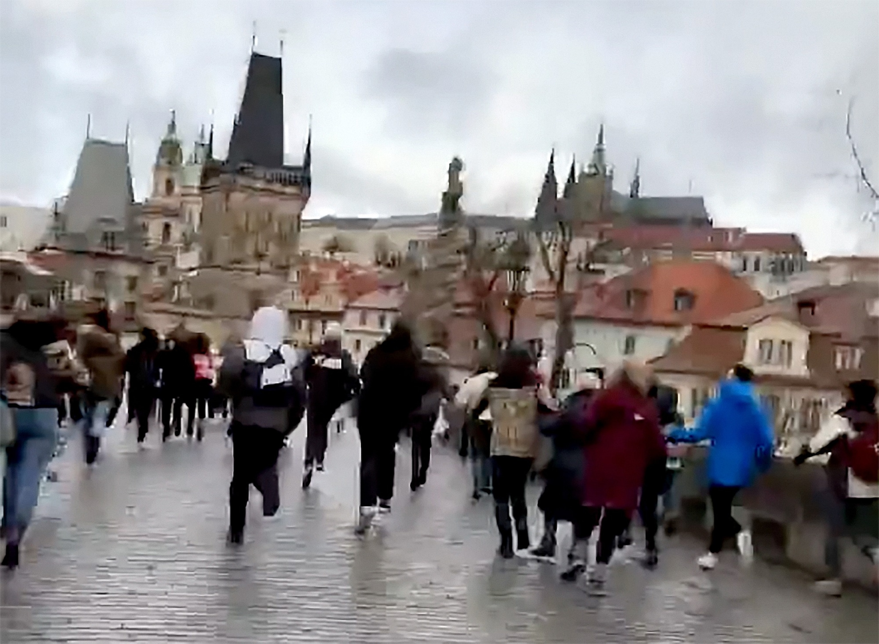 PHOTO: People run from the scene of a shooting in downtown Prague, Czech Republic, Dec. 21, 2023.