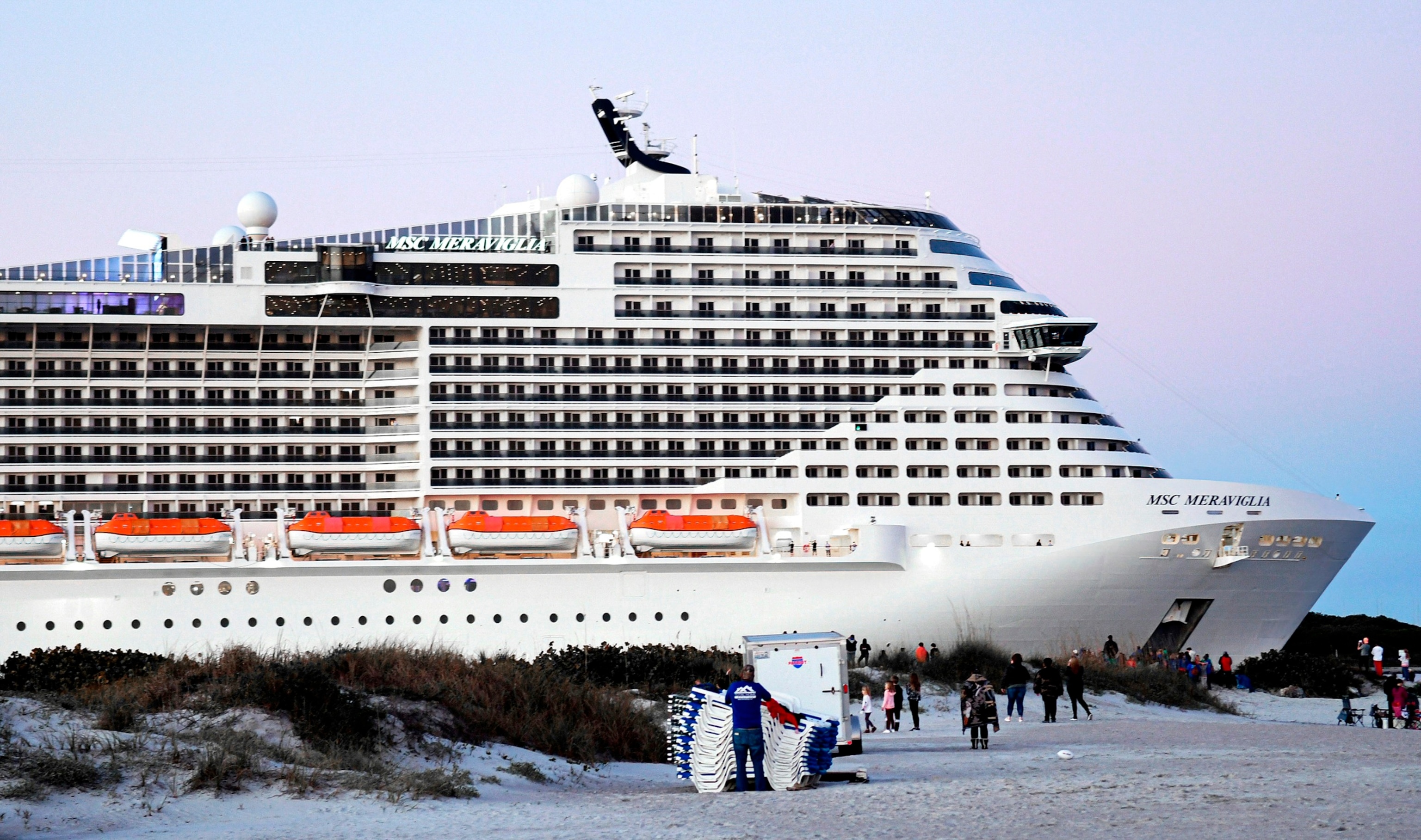 PHOTO: In this Jan. 30, 2022, file photo, people watch as the MSC Meraviglia cruise ship departs from Port Canaveral, Fla.