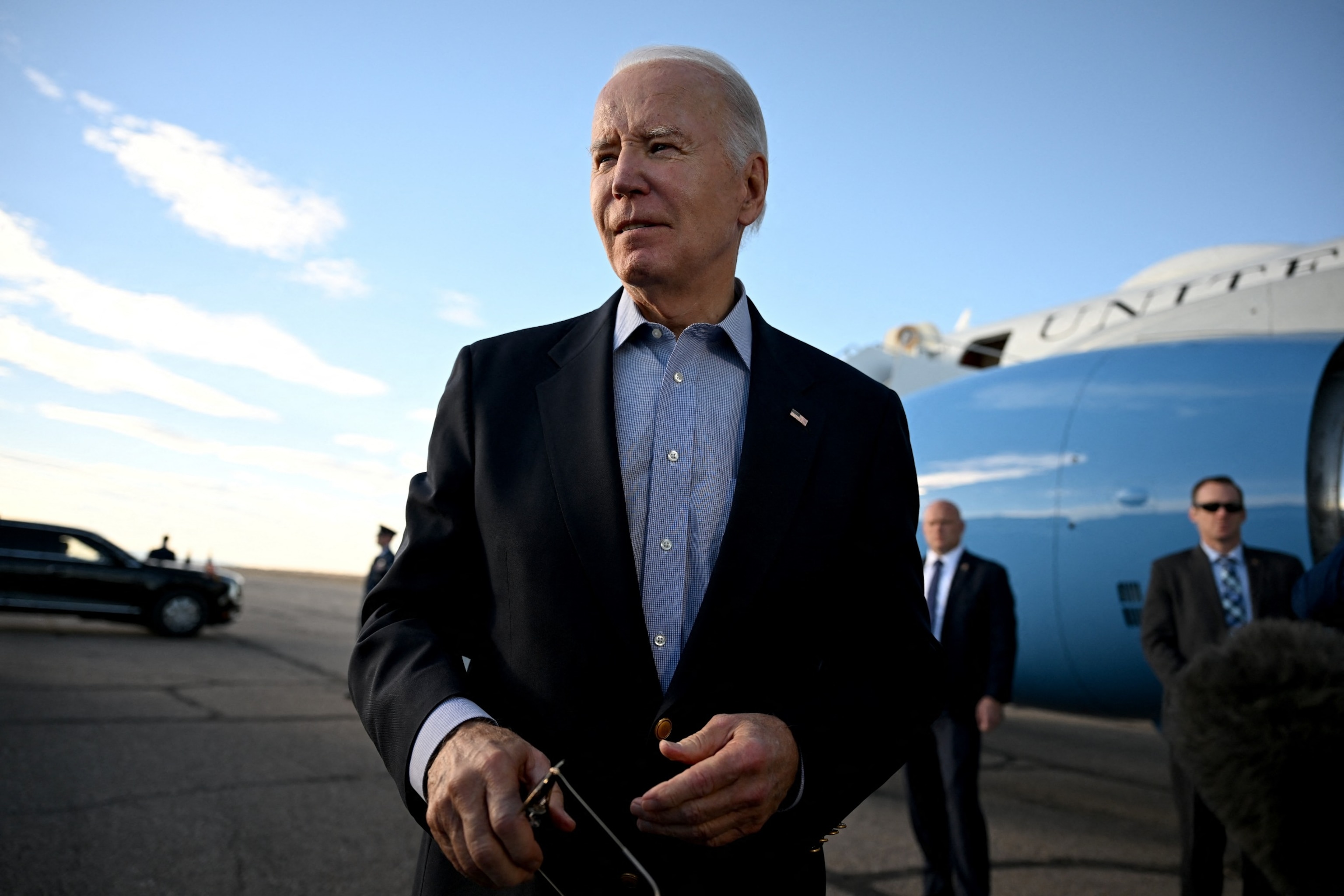 PHOTO: US President Joe Biden speaks to reporters before boarding Air Force One at Pueblo Memorial Airport in Pueblo, Colorado, on November 29, 2023, as he travels back to the White House in Washington, DC. 