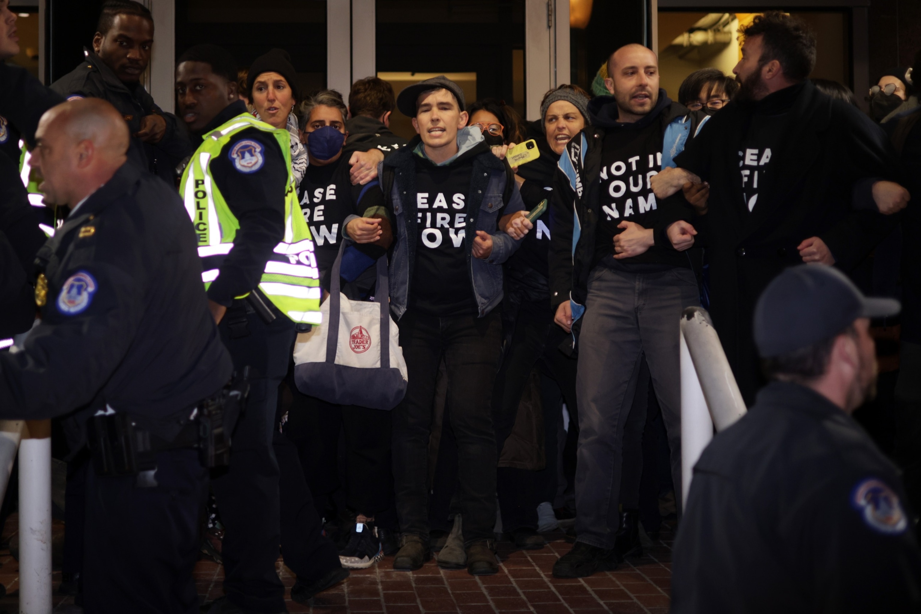 PHOTO: Protesters block the entrance of the headquarters of the Democratic National Committee during a demonstration against the war between Israel and Hamas, Nov. 15, 2023, on Capitol Hill.