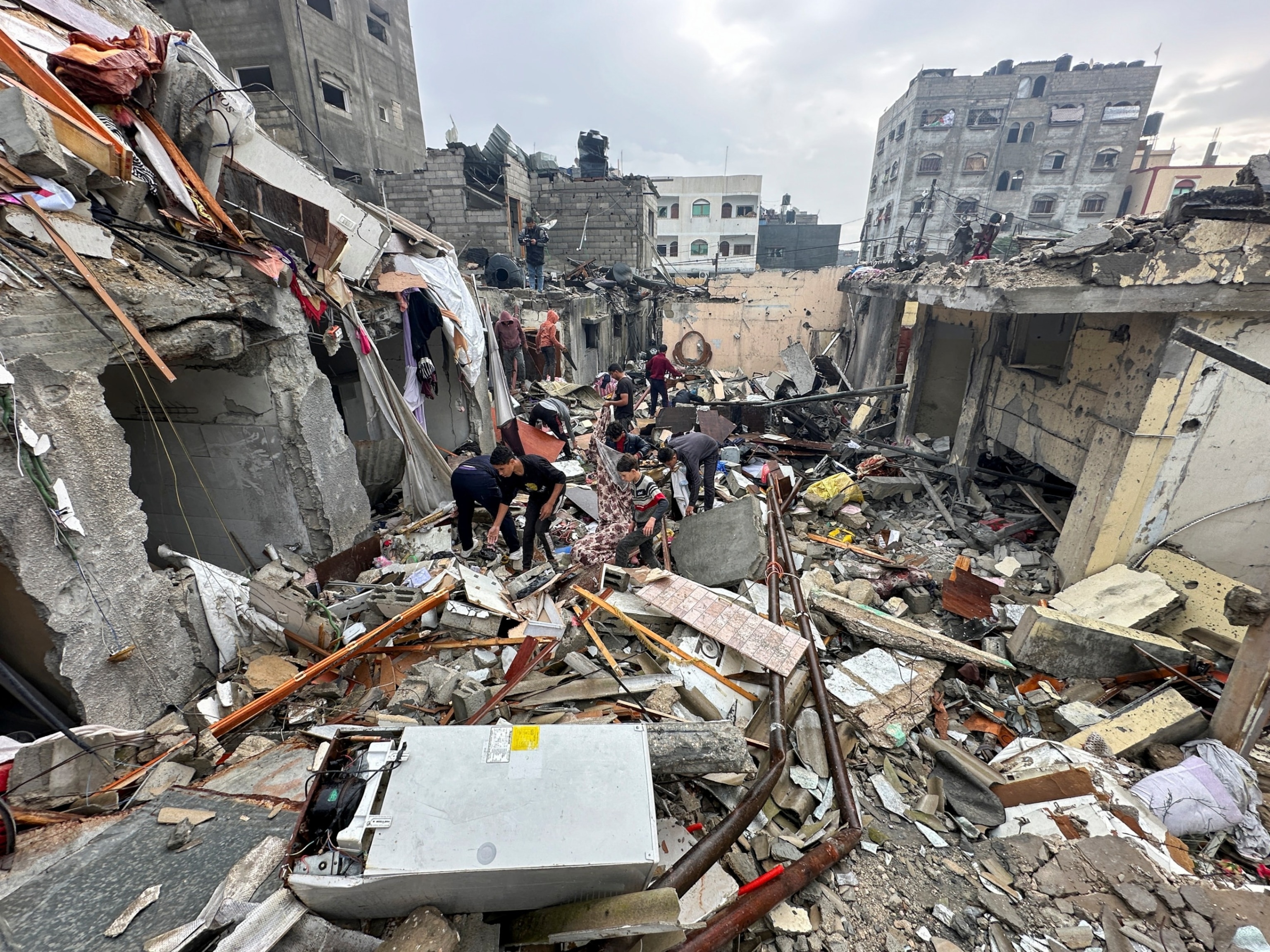 PHOTO: Palestinians inspect the site of Israeli strikes on houses, amid the ongoing conflict between Israel and the Palestinian Islamist group Hamas, in Rafah, in the southern Gaza Strip Dec. 13, 2023. 