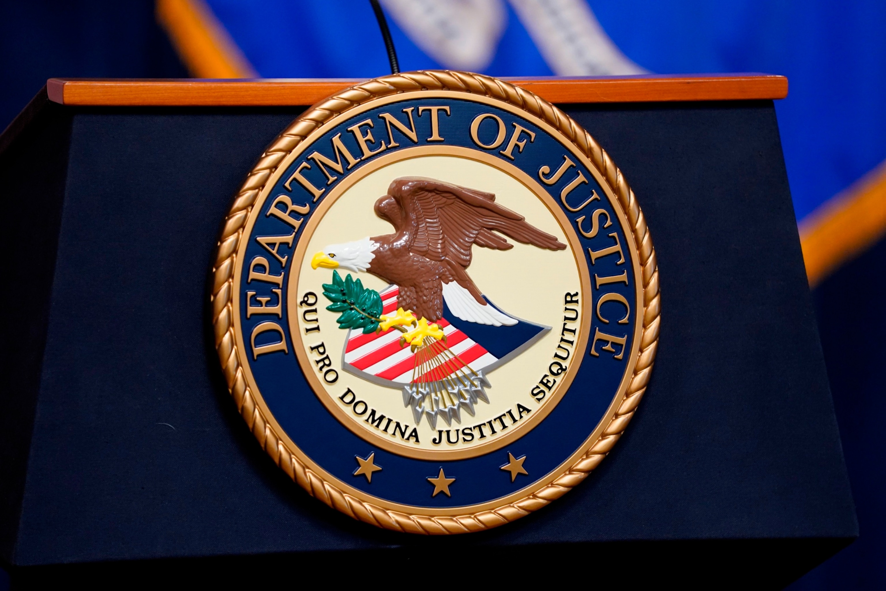 PHOTO: The seal for the United States Department of Justice is displayed on a podium before a news conference at the Justice Department in Washington, April 13, 2023. 