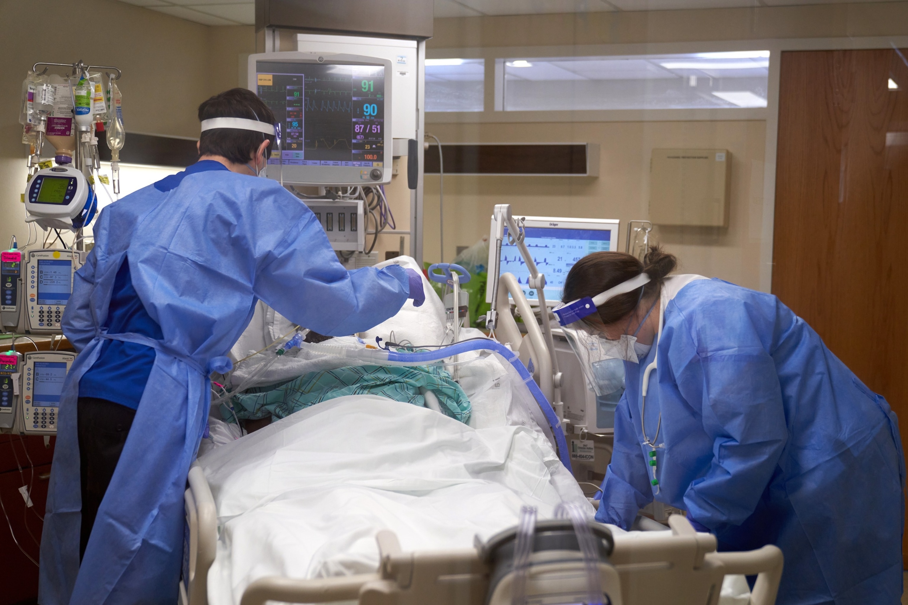 PHOTO: In this Jan. 31, 2022, file photo, healthcare workers treat a Covid-19 patient on the Intensive Care Unit (ICU) floor at Hartford Hospital in Hartford, Conn.