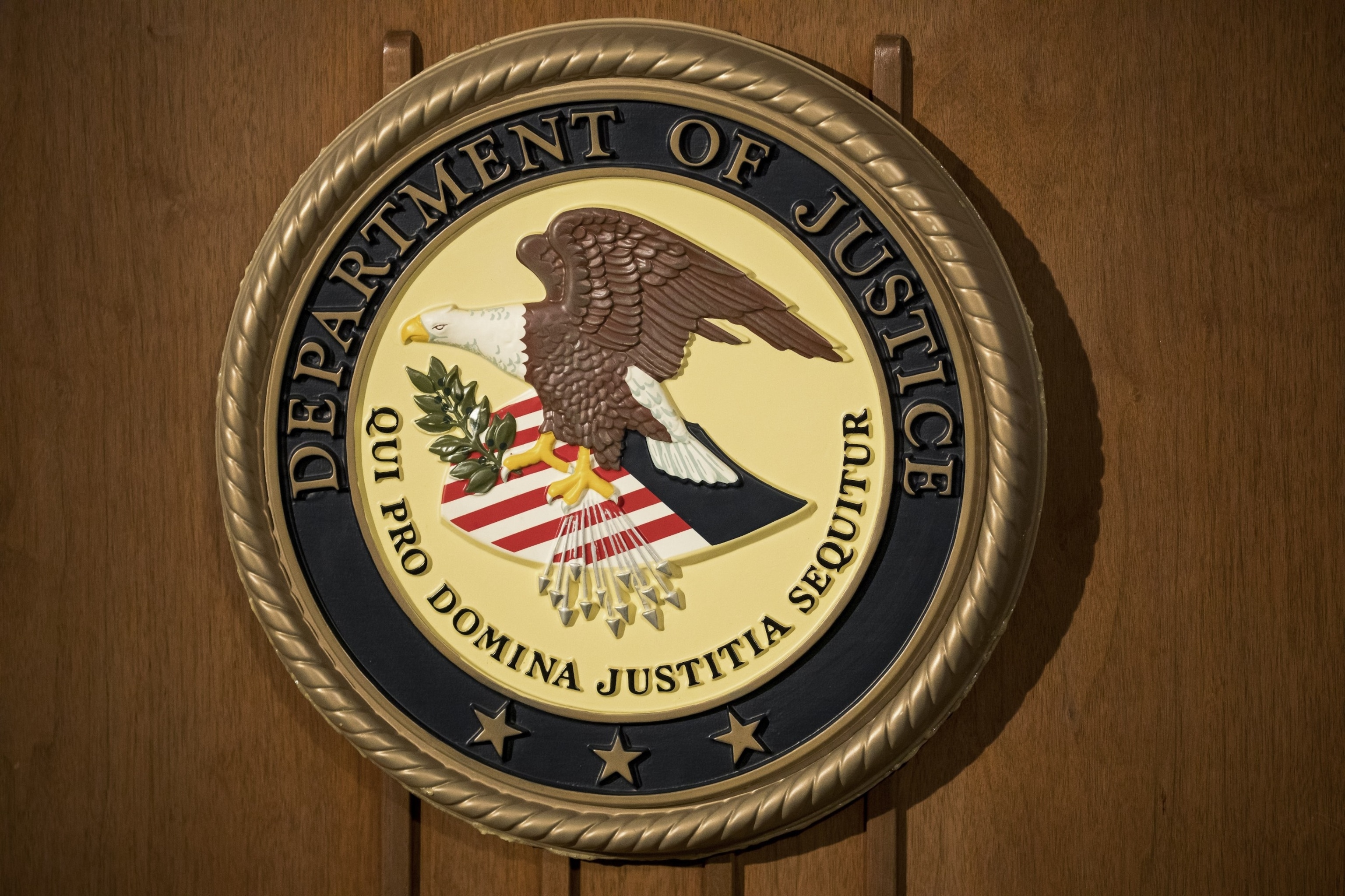 PHOTO: The Department of Justice seal is displayed on a podium during a news conference at the U.S. Attorney's Office in New York, July 2, 2020. 