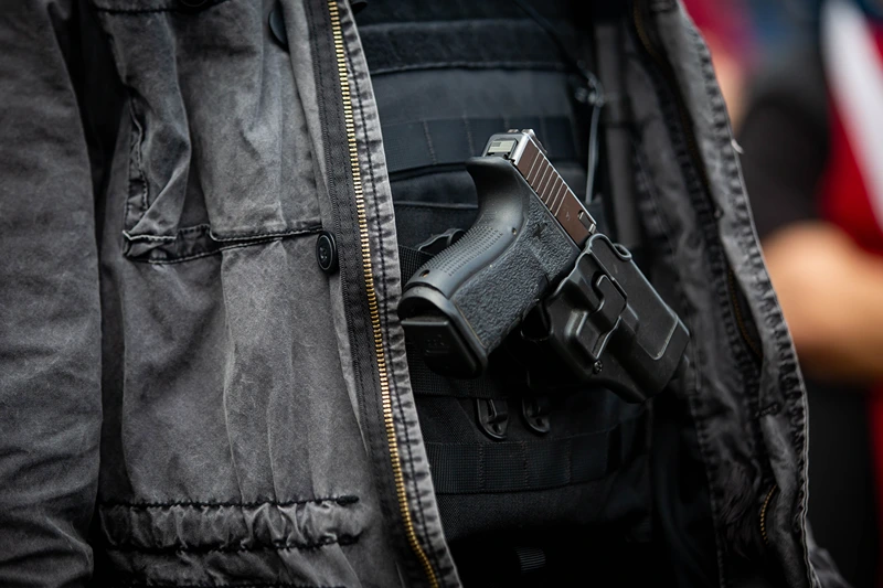 US-VOTE-DEMONSTRATION
A man openly carries a handgun during a Proud Boys rally at Delta Park in Portland, Oregon on September 26, 2020. - Far-right group "Proud Boys" members gather in Portland to show support to US president Donald Trump and to condemn violence that have been occurring for more than three months during "Black Lives Matter" and "Antifa" protests. (Photo by Maranie R. STAAB / AFP) (Photo by MARANIE R. STAAB/AFP via Getty Images)