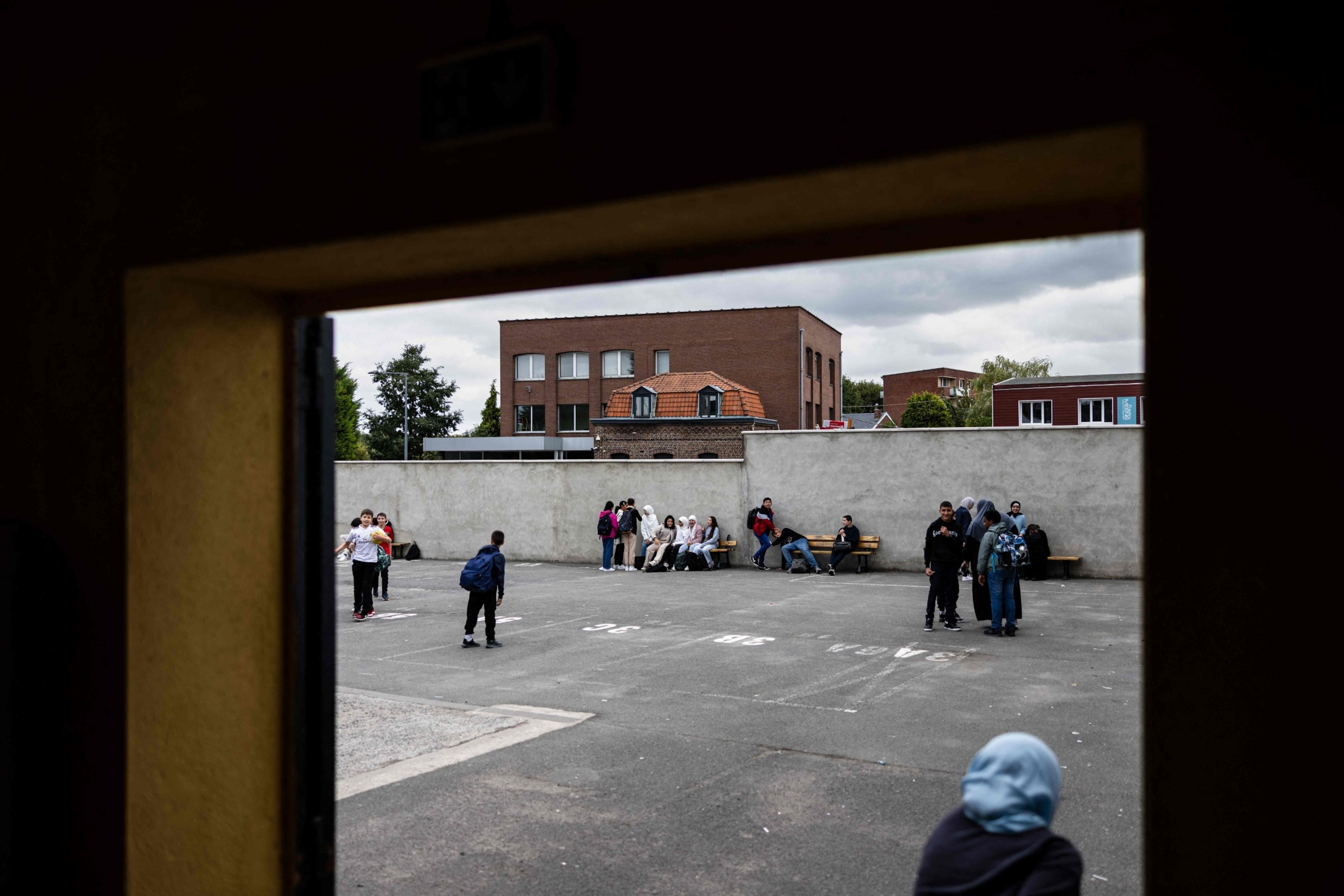 PHOTO: Teenagers play during a break at the Averroes high school in Lille, northern France on Sept. 28, 2023. 