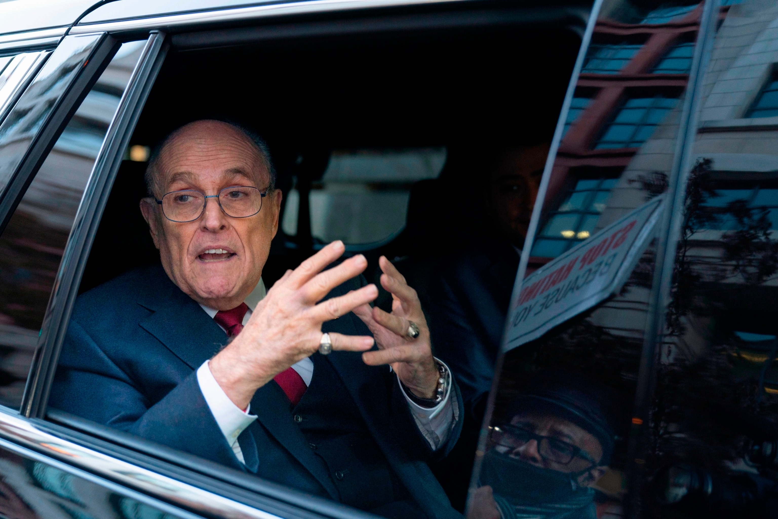 PHOTO: Former Mayor of New York Rudy Giuliani talks to reporters as he leaves after his defamation trial in Washington, D.C., Dec. 15, 2023. 