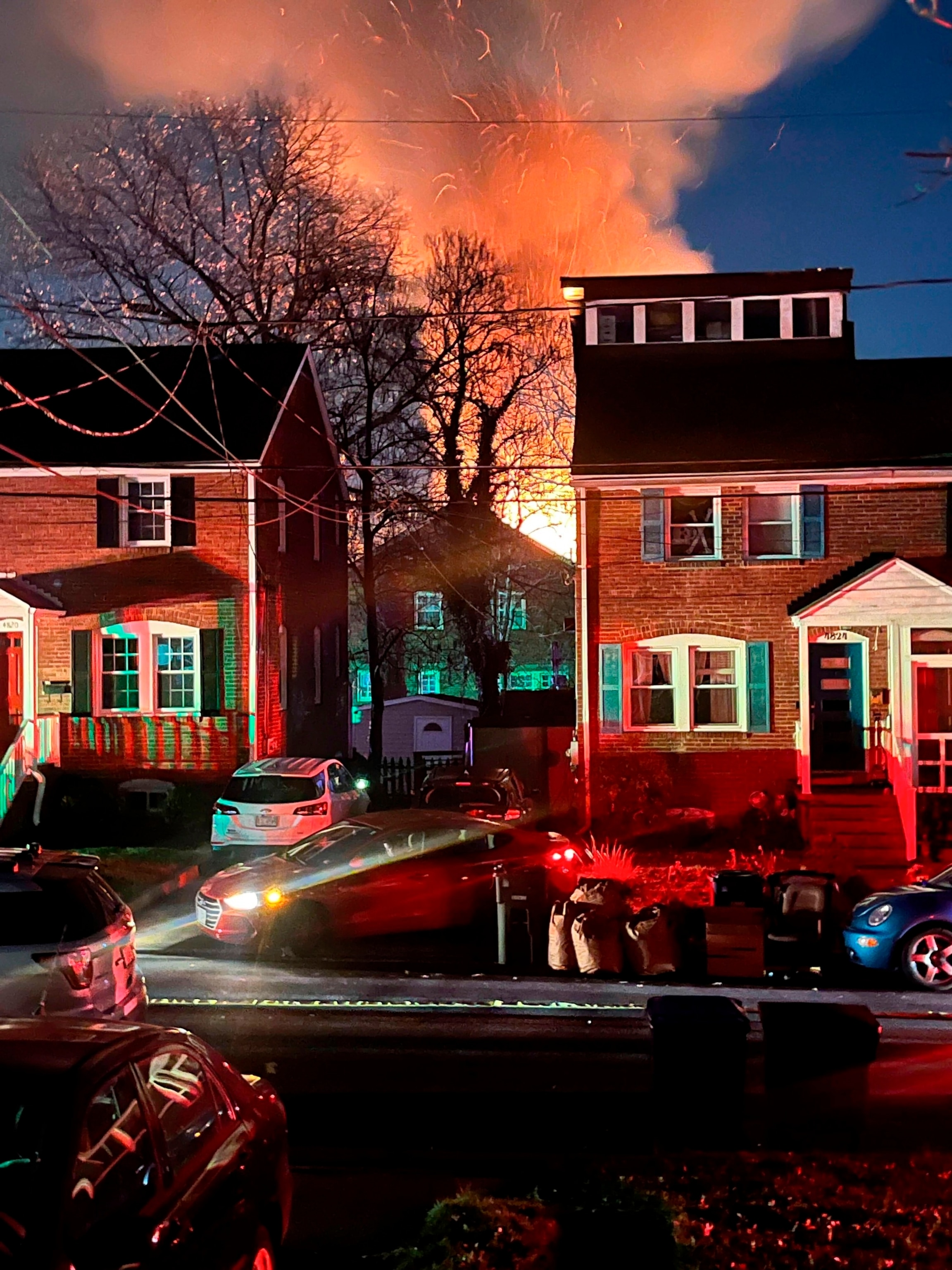 PHOTO: A home is seen exploding from a distance, Monday night, Dec. 4, 2023 in Arlington, Va. 