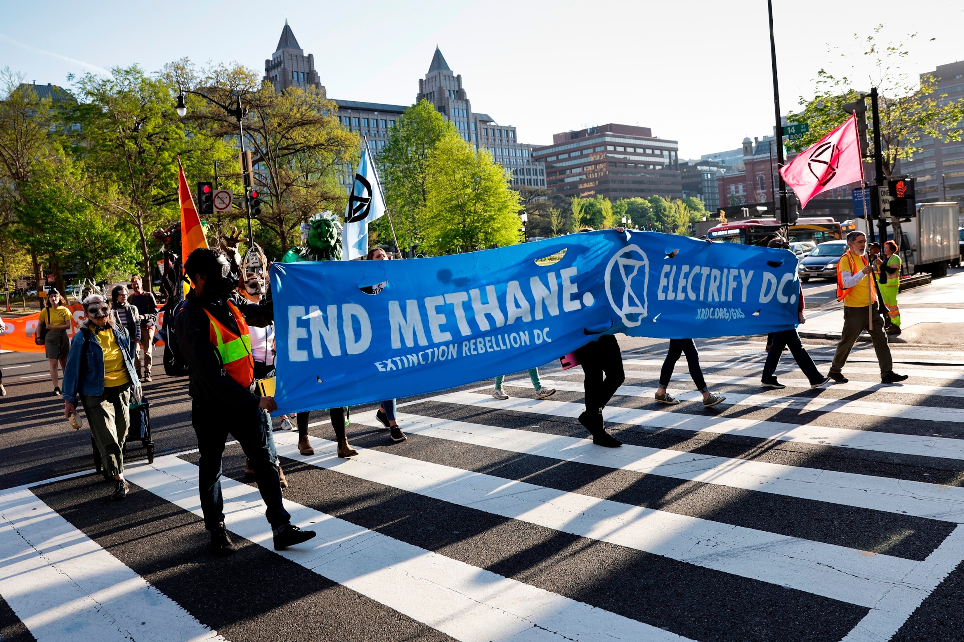 PHOTO: Environmental activists with the group Extinction Rebellion D.C. participate in an Earth Day rally against fossil fuels, April 22, 2022, in Washington.
