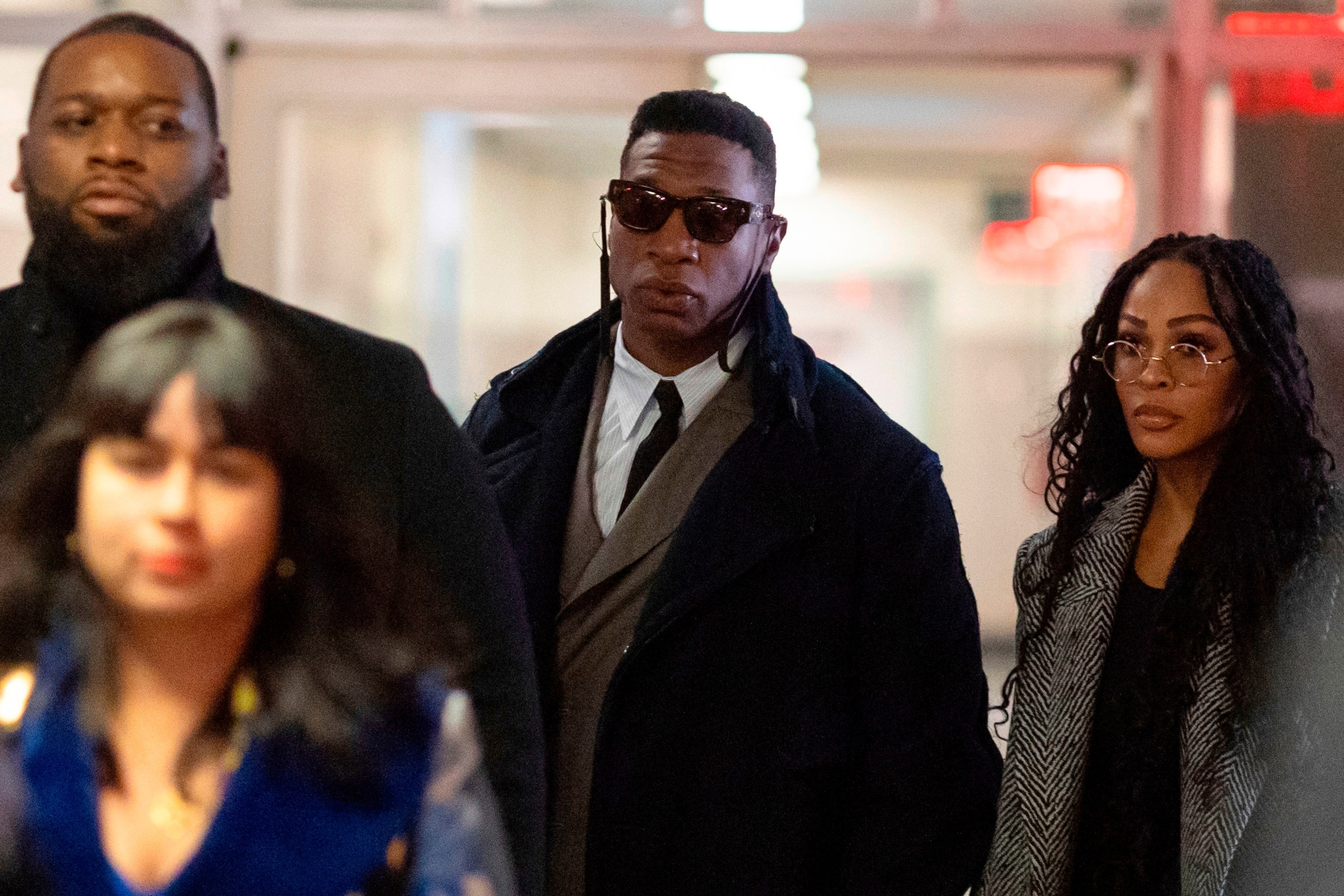 PHOTO: Actors Jonathan Majors, center, and Meagan Good, right, arrive at court for a jury selection on Major's domestic violence case, Wednesday, Nov. 29, 2023, in New York. 