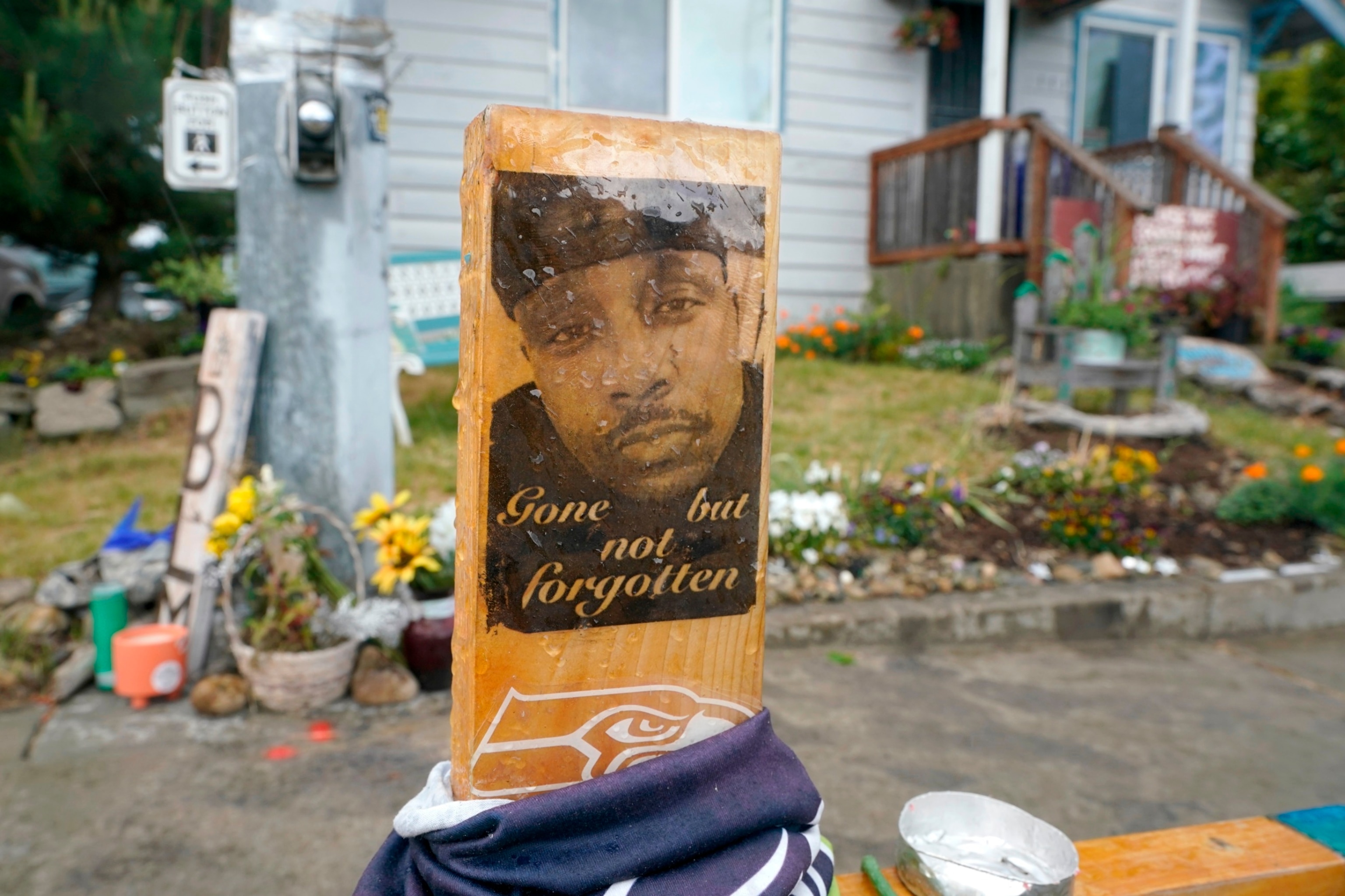 PHOTO: A sign is displayed, May 27, 2021, at a memorial in Tacoma, Wash., where Manuel "Manny" Ellis died March 3, 2020, after he was restrained by police officers. 