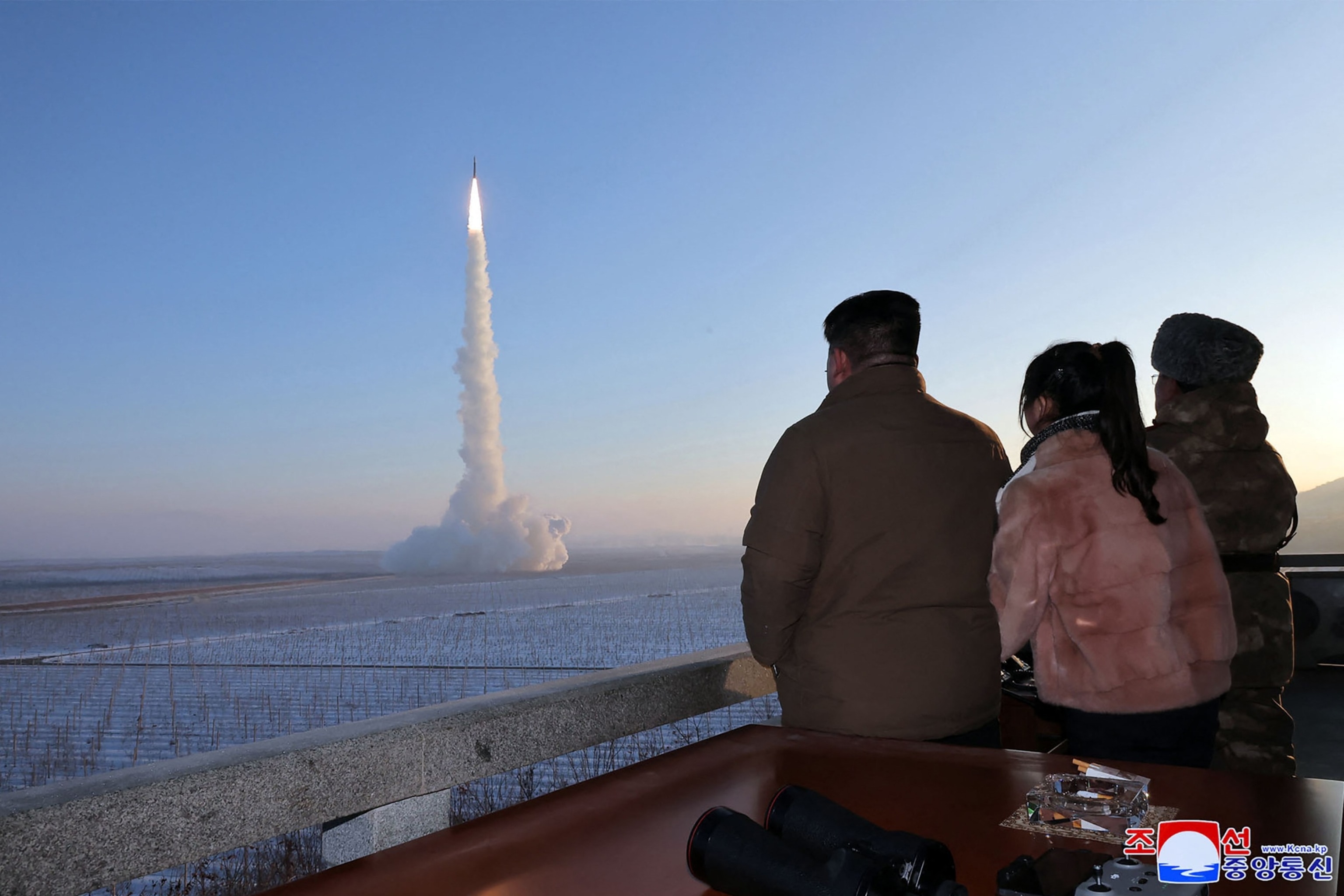 PHOTO: This undated picture released by North Korea's official Korean Central News Agency on Dec.19, 2023, shows Kim Jong Un and his daughter watching the test launch of an intercontinental ballistic missile ICBM at an undisclosed location. 