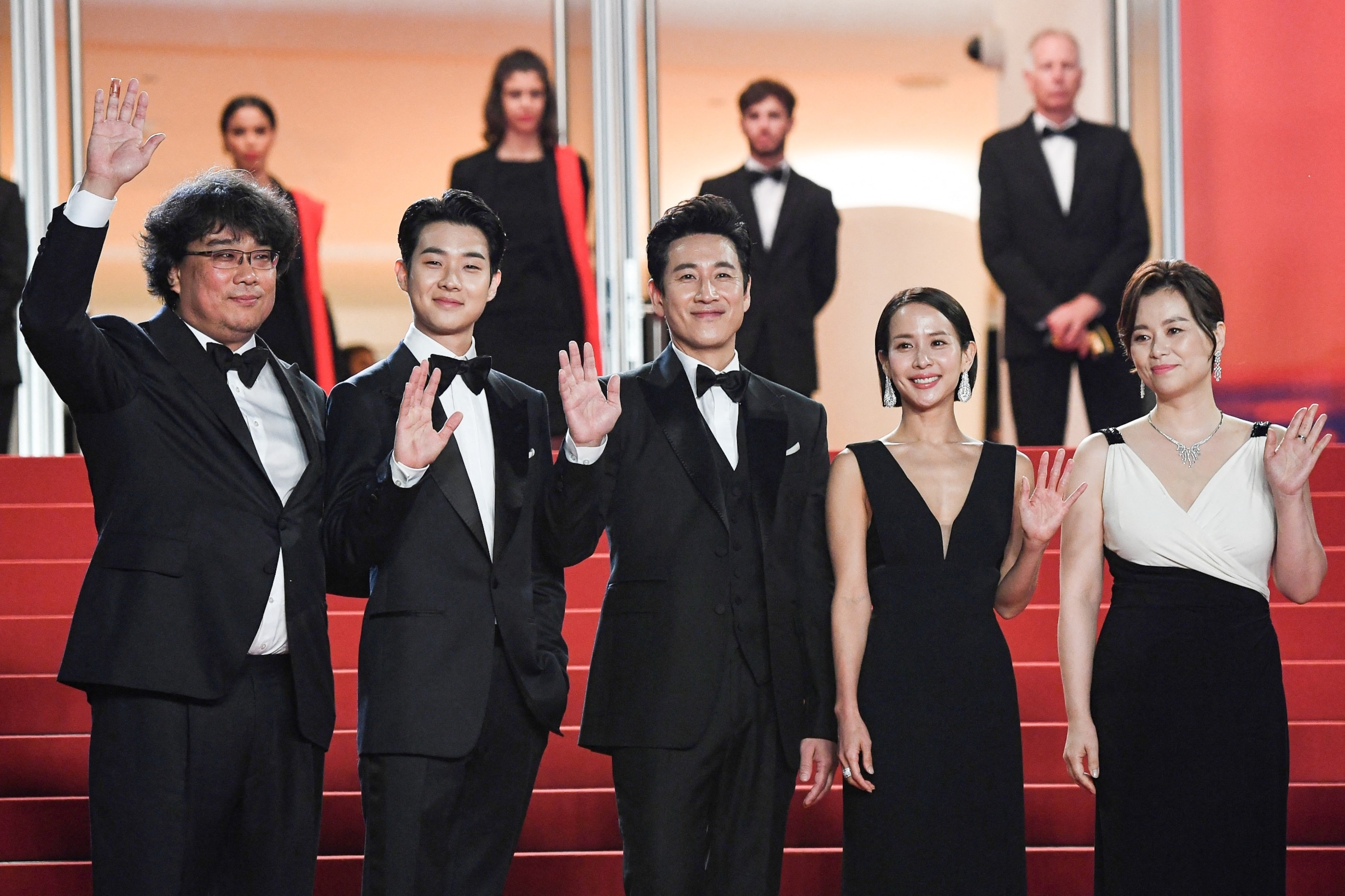 South Korean director Bong Joon-Ho, actor Choi Woo-shik, actor Lee Sun-kyun, actress Cho Yeo-jeong and actress Chang Hyae-jin arrive for the screening of the film "Parasite" at the Cannes Film Festival in Cannes, southern France, on May 21, 2019