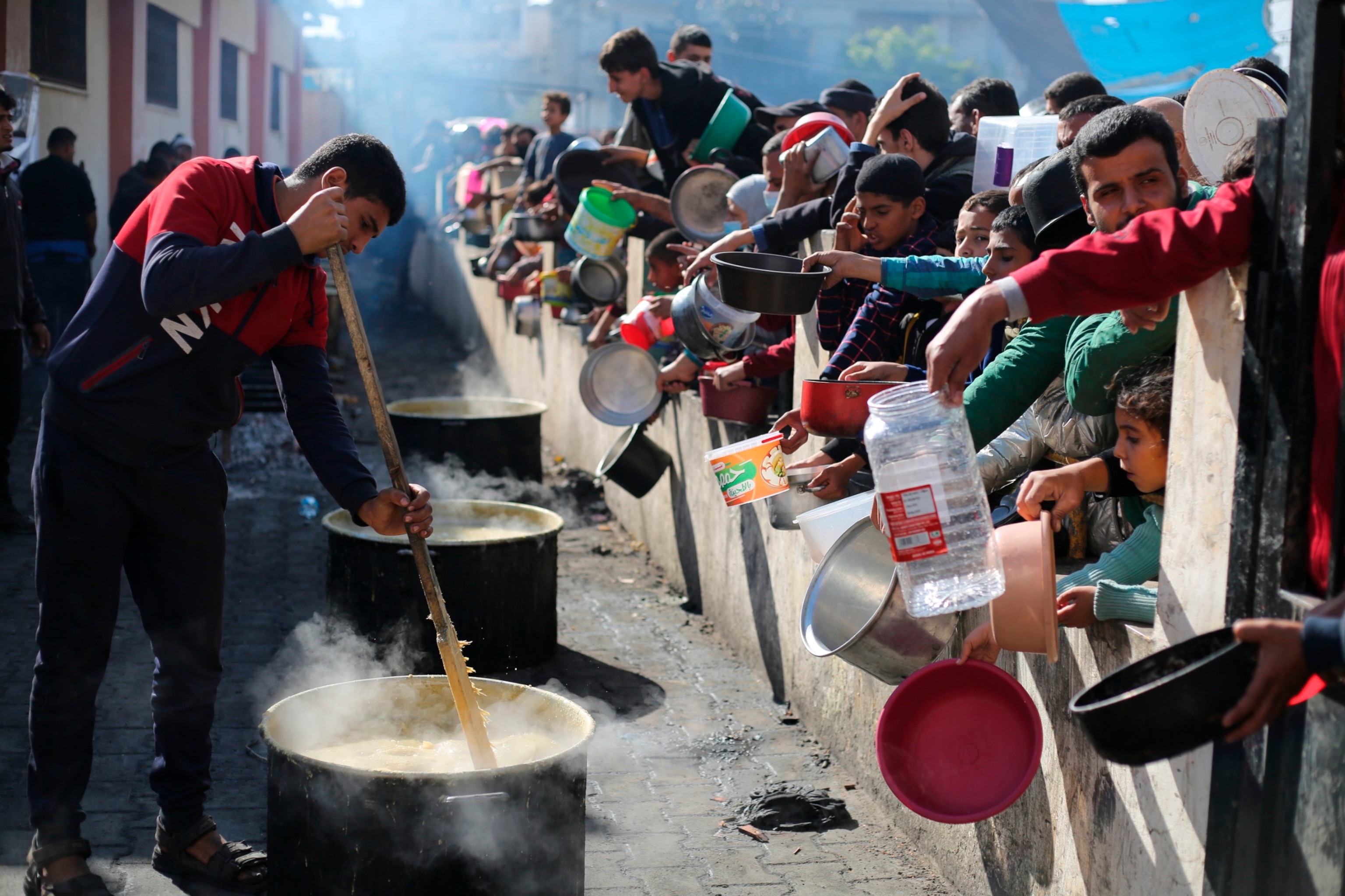 PHOTO: Palestinians line up for a free meal in Rafah, Gaza Strip, Dec. 20, 2023. 