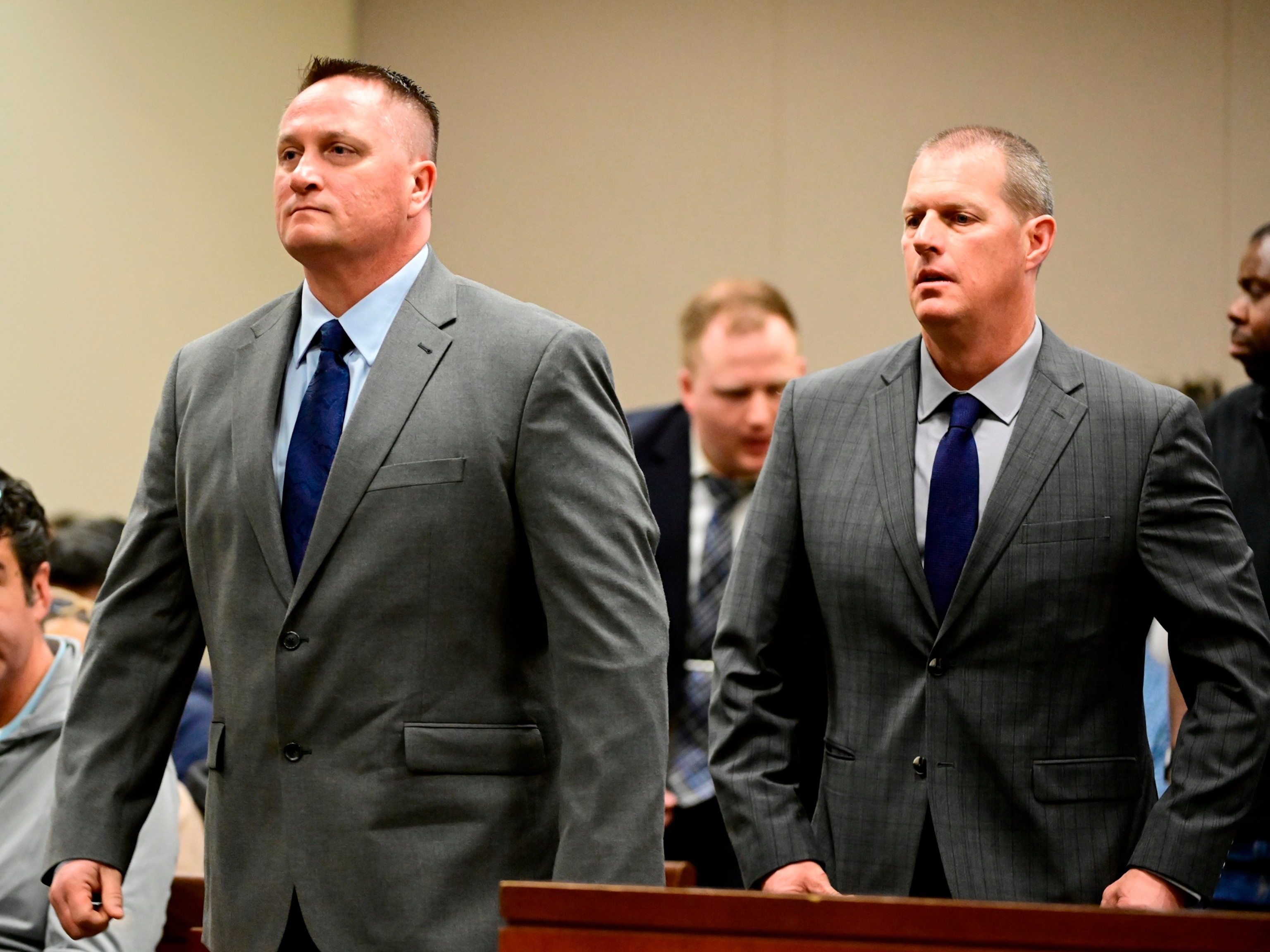 PHOTO: Paramedics Jeremy Cooper, left, and Peter Cichuniec, right, at an arraignment in the Adams County district court at the Adams County Justice Center Jan. 20, 2023. 