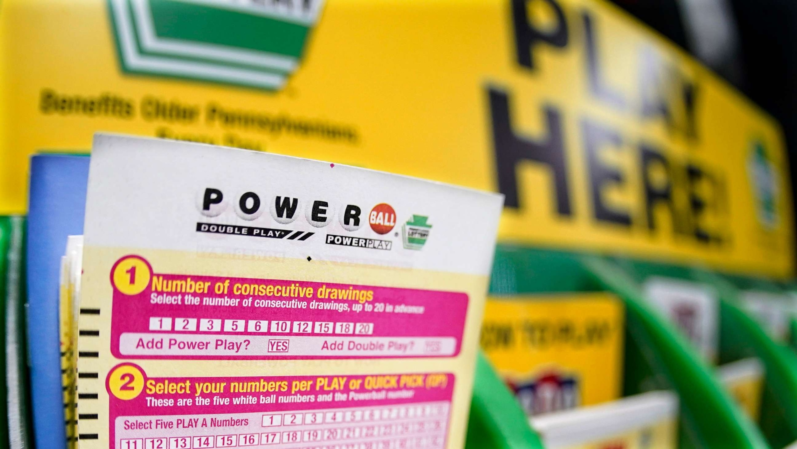 PHOTO: A rack with cards people can use to choose their own numbers to purchase lottery tickets for the Saturday Oct. 29, drawing of the Powerball lottery, are seen on a counter at a market in Prospect, Pa., Oct. 28, 2022.