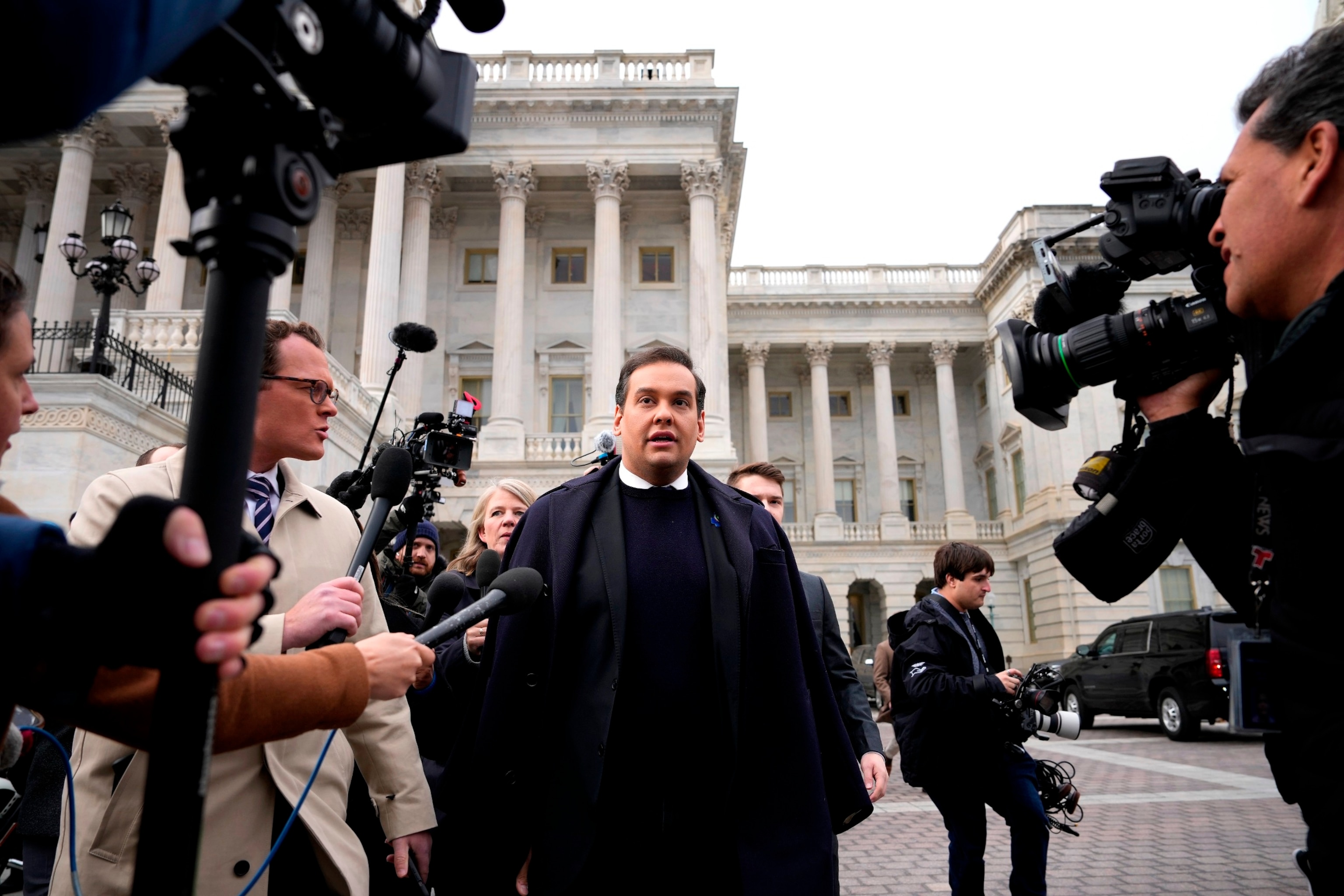 PHOTO: Rep. George Santos is surrounded by journalists as he leaves the U.S. Capitol after his fellow members of Congress voted to expel him from the House of Representatives on Dec. 1, 2023 in Washington, DC. 