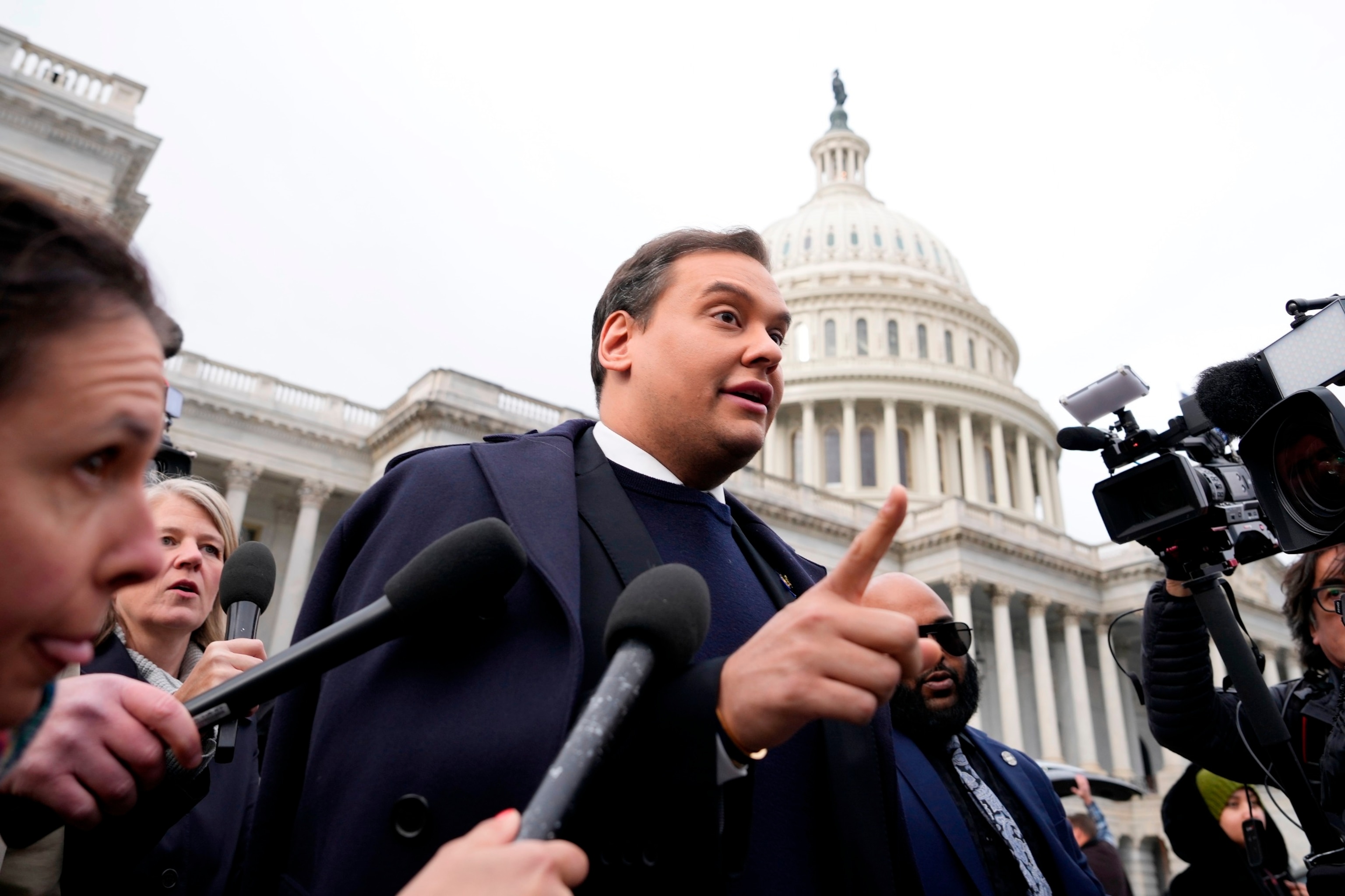 PHOTO: Rep. George Santos is surrounded by journalists as he leaves the U.S. Capitol after his fellow members of Congress voted to expel him from the House of Representatives on Dec. 1, 2023 in Washington, DC.