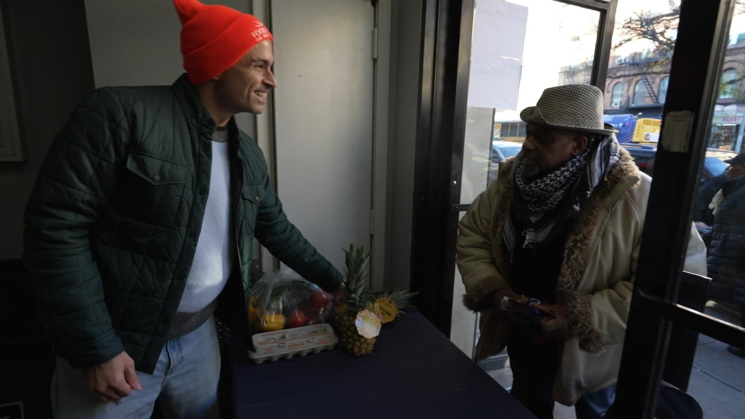 PHOTO: A volunteer from Food Bank for New York City's Community Kitchen and Pantry helps hand out food donations in New York City.