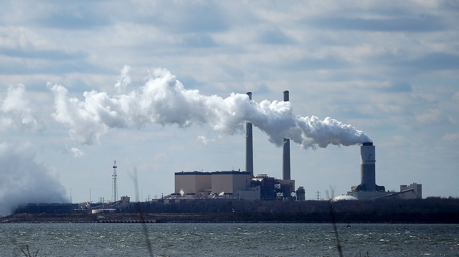 Emissions spew from a large stack at the coal-fired Brandon Shores Power Plant in Baltimore on March 9, 2018.