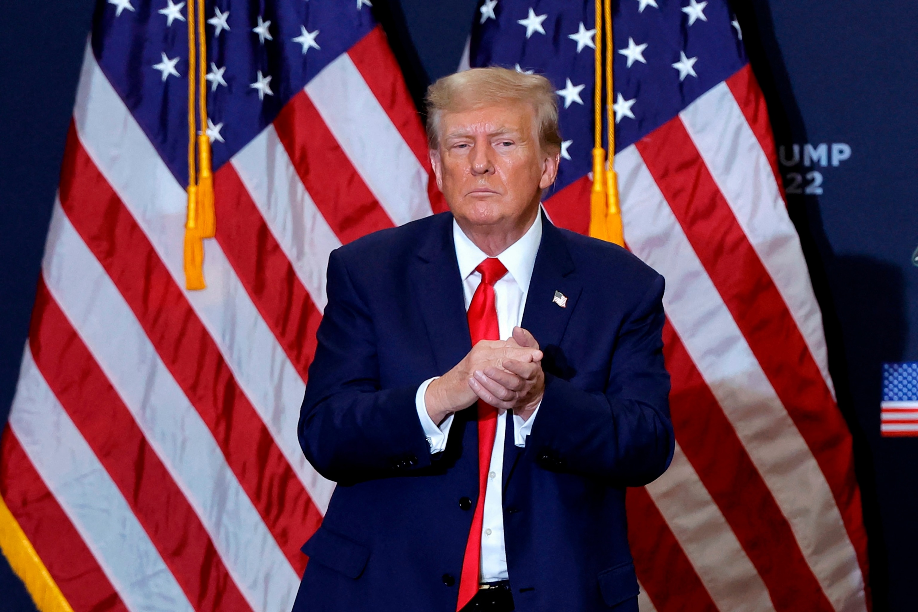 Former President Donald Trump gestures at the end of a campaign event in Waterloo, Iowa, on December 19, 2023. (Photo by KAMIL KRZACZYNSKI / AFP)