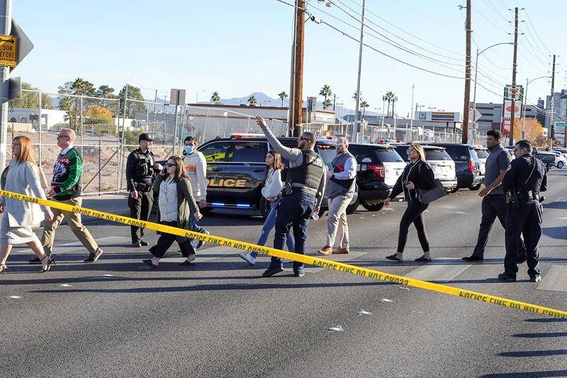 Multiple Victims In Shooting On UNLV Campus
LAS VEGAS, NEVADA - DECEMBER 06: People cross Maryland Parkway as they are led off of the UNLV campus after a shooting on December 06, 2023 in Las Vegas, Nevada. According to Las Vegas Metro Police, a suspect is dead and multiple victims are reported after a shooting on the campus. (Photo by Ethan Miller/Getty Images)