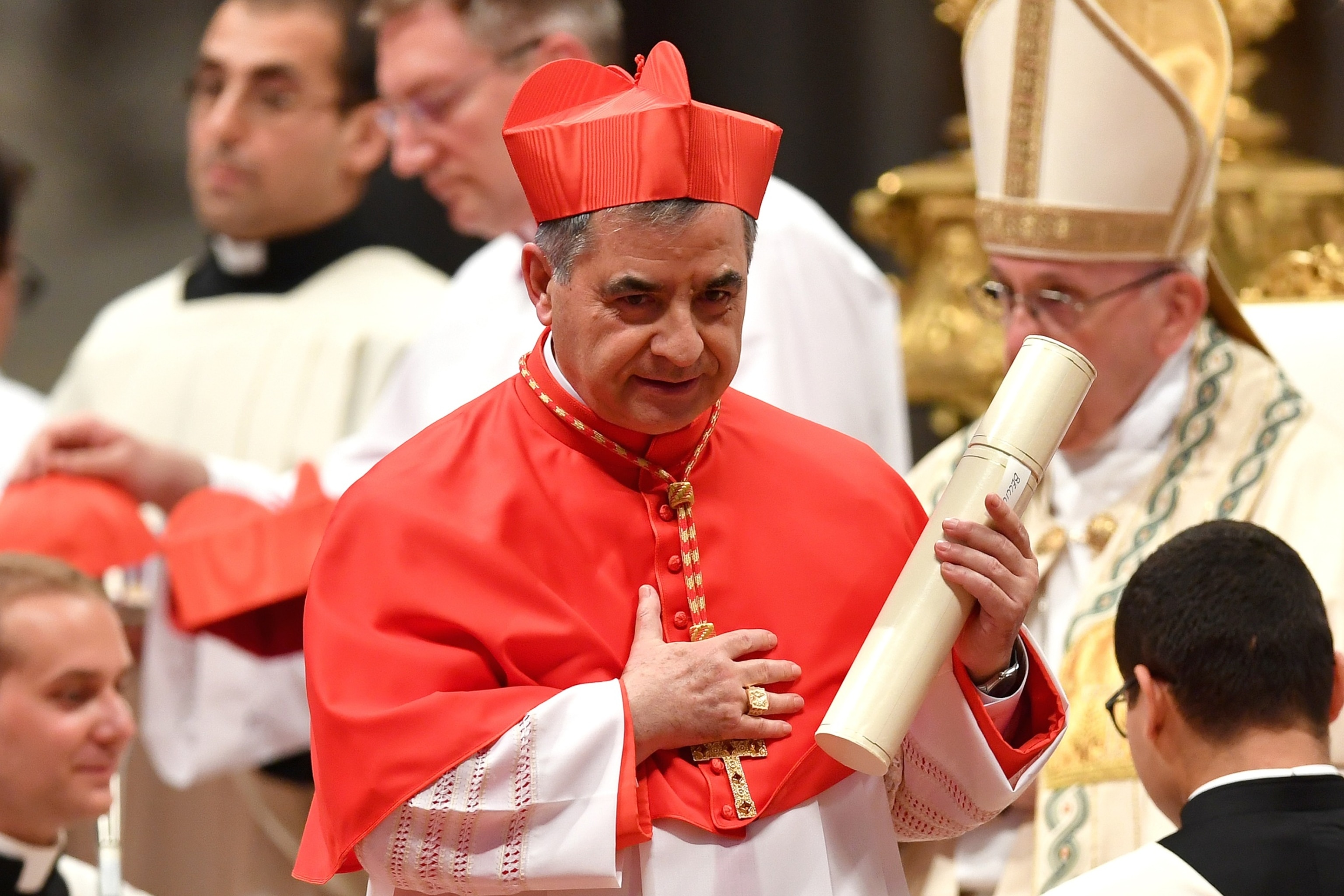 PHOTO: In this June 28, 2018 file photo, Cardinal Giovanni Angelo Becciu leaves after kneeling before Pope Francis to pledge allegiance and become a cardinal at St. Peter's basilica in Vatican City. 