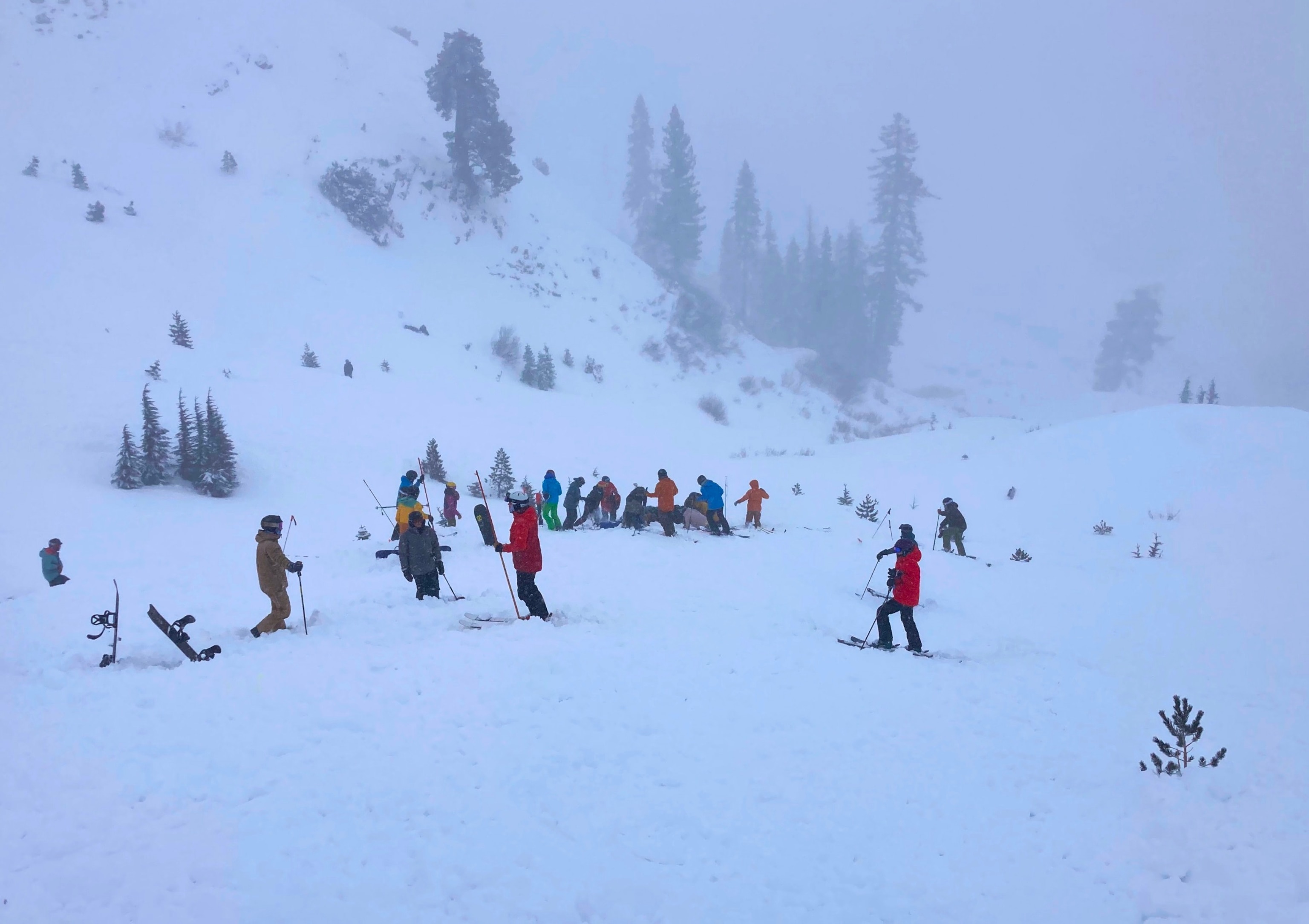 PHOTO: People dig a person out of the snow after an avalanche closed down ski slopes at Palisades Tahoe resort in Olympic Valley, Calif., on Wednesday, Jan. 10, 2024.