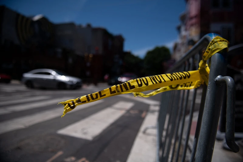 US-CRIME-SHOOTING-PHILADELPHIA-POLICE
Police tape hangs from a barricade at the corner of South and 3rd Streets in Philadelphia, Pennsylvania, on June 5, 2022, the day after three people were killed and 11 others wounded by gunfire all within a few blocks. - Three people were killed and 11 others wounded late on June 4, 2022, in the US city of Philadelphia after multiple shooters opened fire into a crowd on a busy street, police said. (Photo by Kriston Jae Bethel / AFP) (Photo by KRISTON JAE BETHEL/AFP via Getty Images)