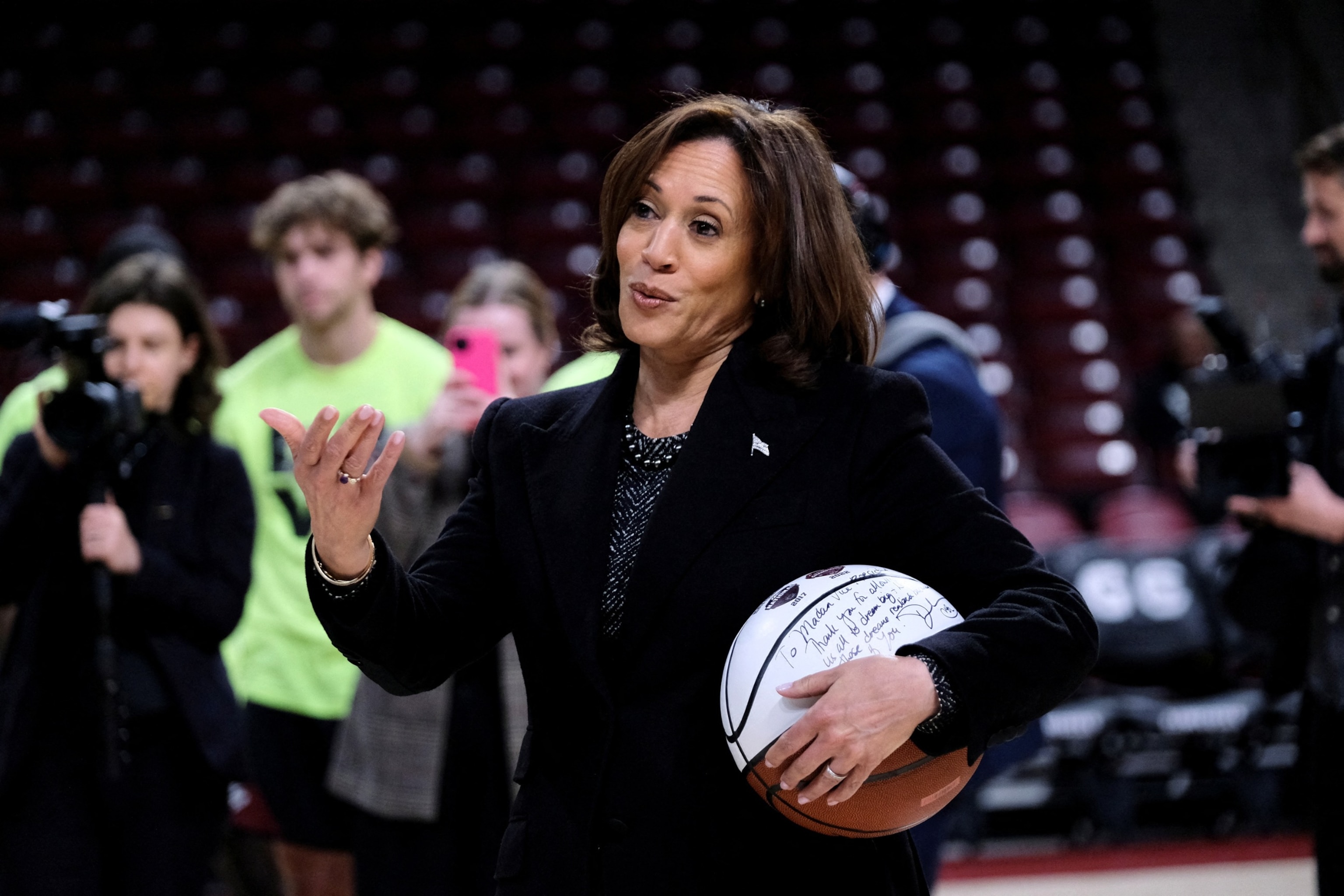 PHOTO: Vice President Kamala Harris holds a ball signed by the members of the currently number 1 ranked women's NCAA basketball team South Carolina Gamecocks during a visit in Columbia, South Carolina, on Jan. 15, 2024. 