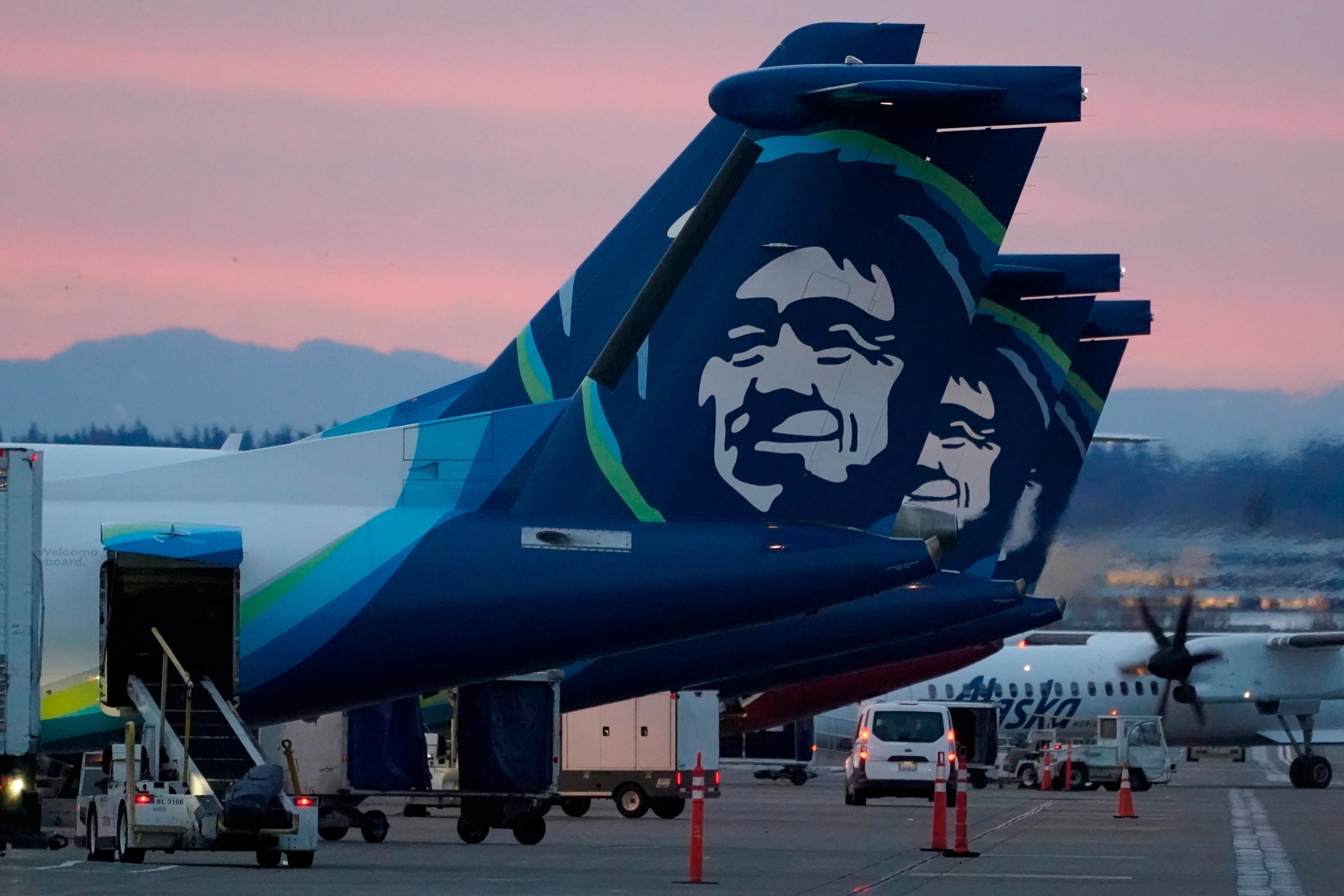 PHOTO: In this file photo, Alaska Airlines planes are shown parked at gates at sunrise, March 1, 2021, at Seattle-Tacoma International Airport in Seattle, Washington. 