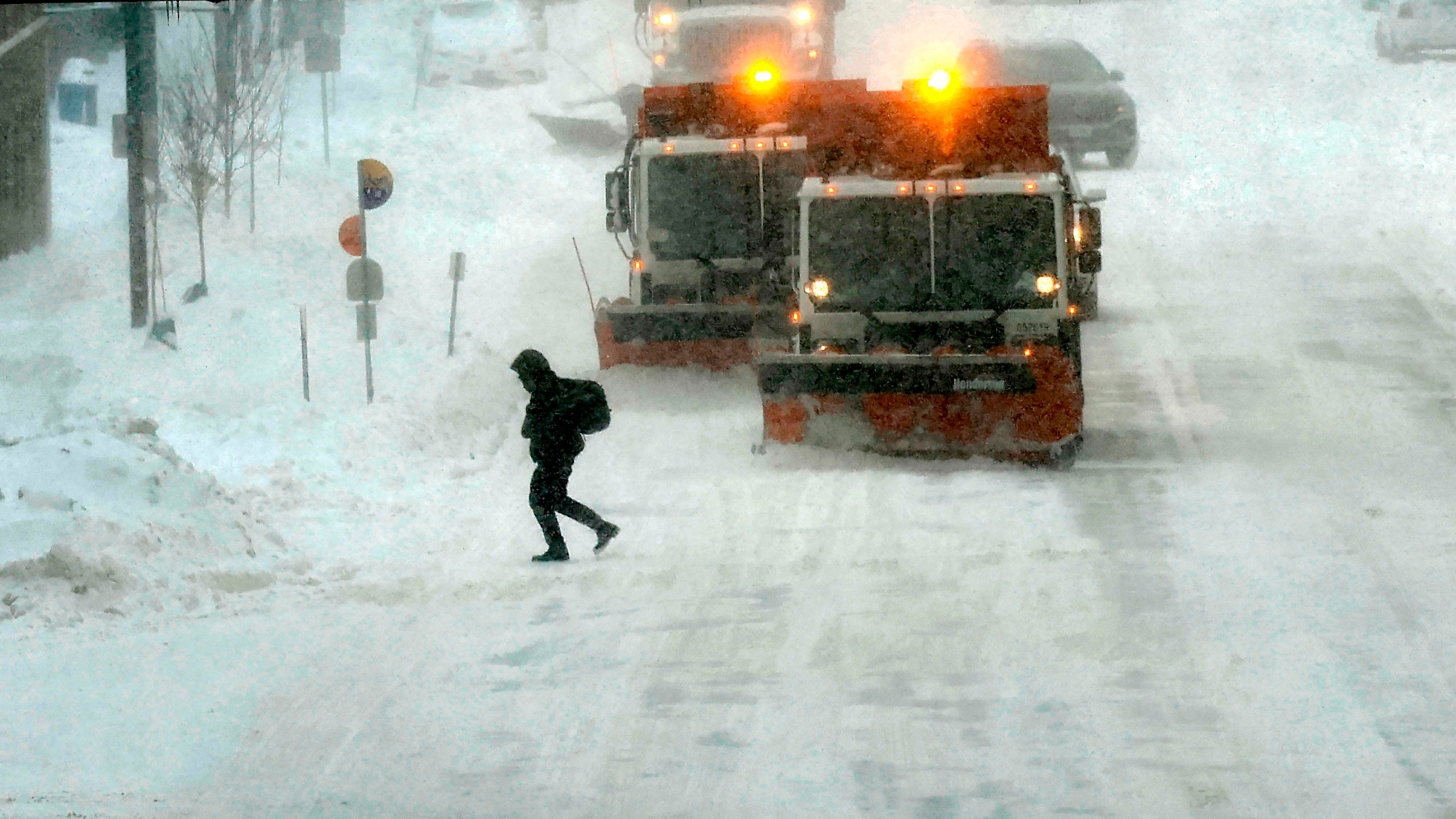 PHOTO: Plow trucks clear Grand Avenue as high winds and snow from winter storm Gerri four days before the Iowa caucuses, on Jan. 12, 2024, in Des Moines, Iowa. 
