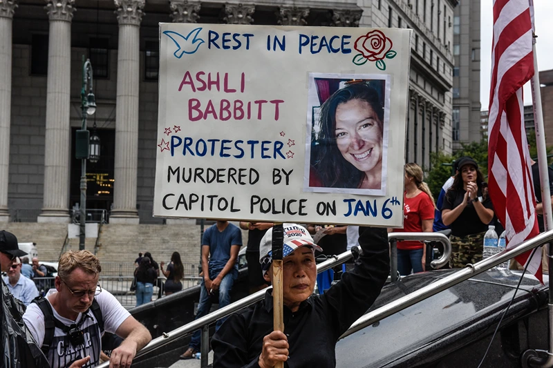 Rallies Held In New York City Protest Against Political Imprisonment NEW YORK, NY - JULY 25: A right wing protester holds a sign about Ashli Babbitt while participating in a political rally on July 25, 2021 in New York City. Protesters were demanding a release of the people who were arrested on January 6th for their involvement in the breach of the Capitol building. (Photo by Stephanie Keith/Getty Images)