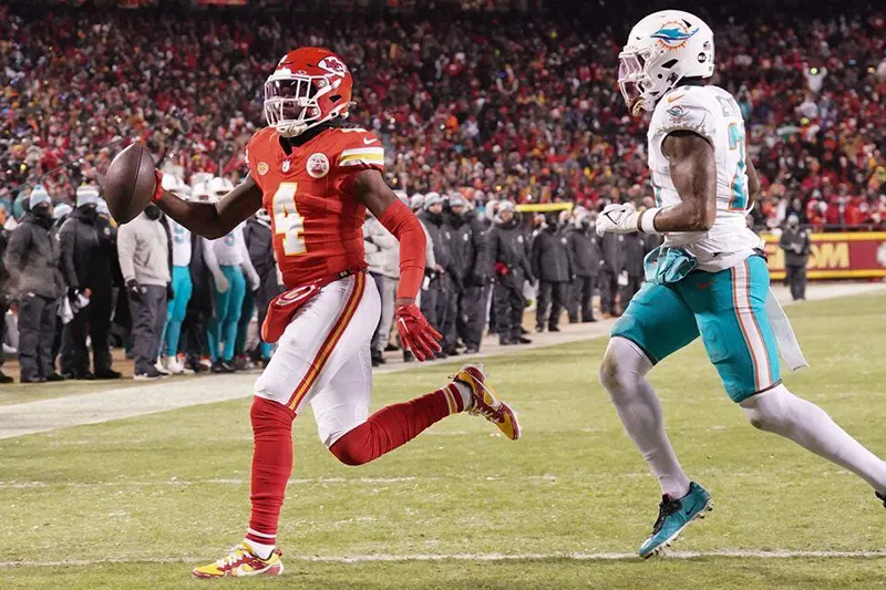 Kansas City Chiefs wide receiver Rashee Rice (4) runs the ball for a touchdown against the Miami Dolphins during the first half of the 2024 AFC wild card game at GEHA Field at Arrowhead Stadium. Mandatory Credit: Denny Medley-USA TODAY Sports