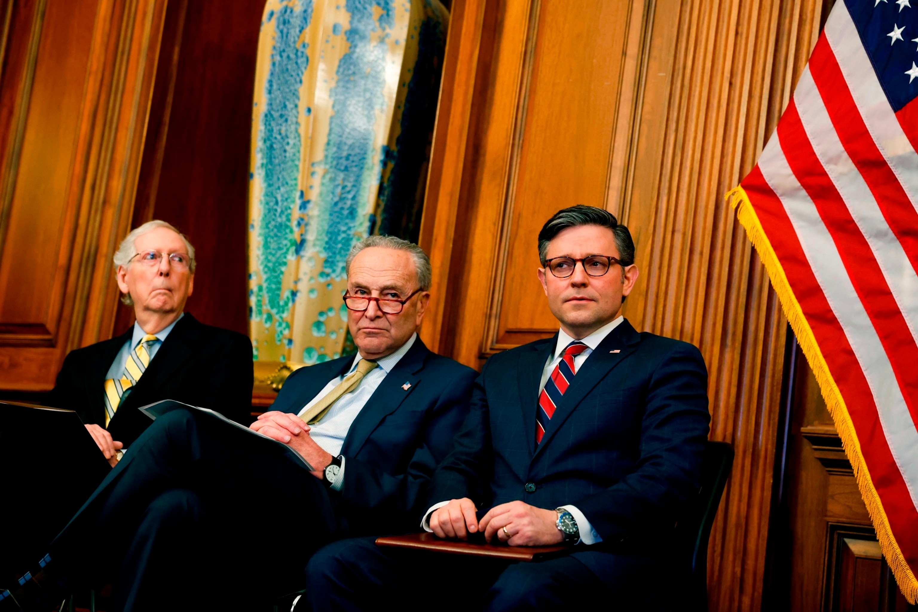 PHOTO: Senate Minority Leader Mitch McConnell, Senate Majority Leader Chuck Schumer and Speaker of the House Mike Johnson listen during during remarks at a Capitol Menorah lighting ceremony at the U.S. Capitol Building, Dec. 12, 2023 in Washington, DC.