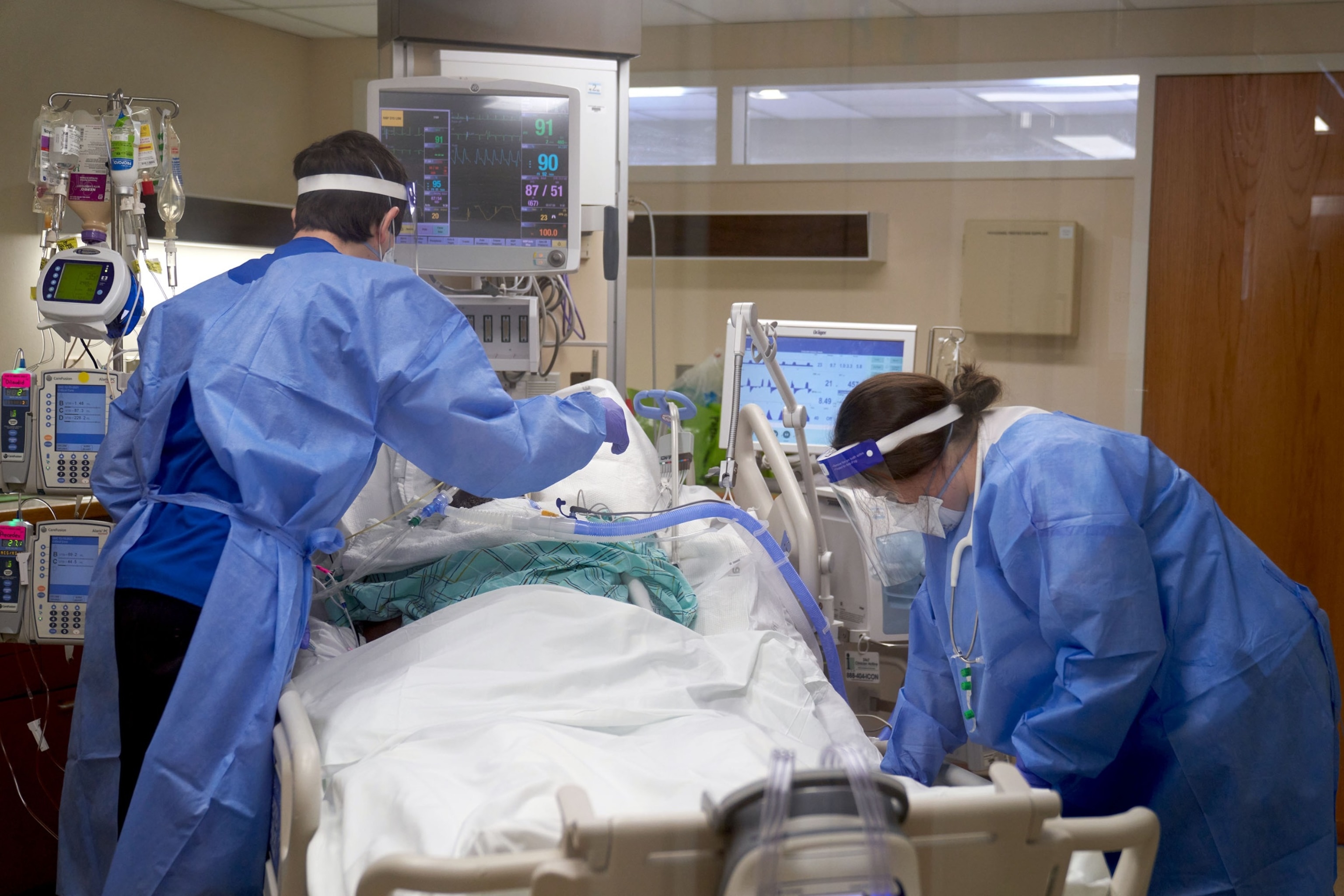 PHOTO: Healthcare workers treat a Covid-19 patient on the Intensive Care Unit (ICU) floor at Hartford Hospital in Hartford, Jan. 31, 2022. 