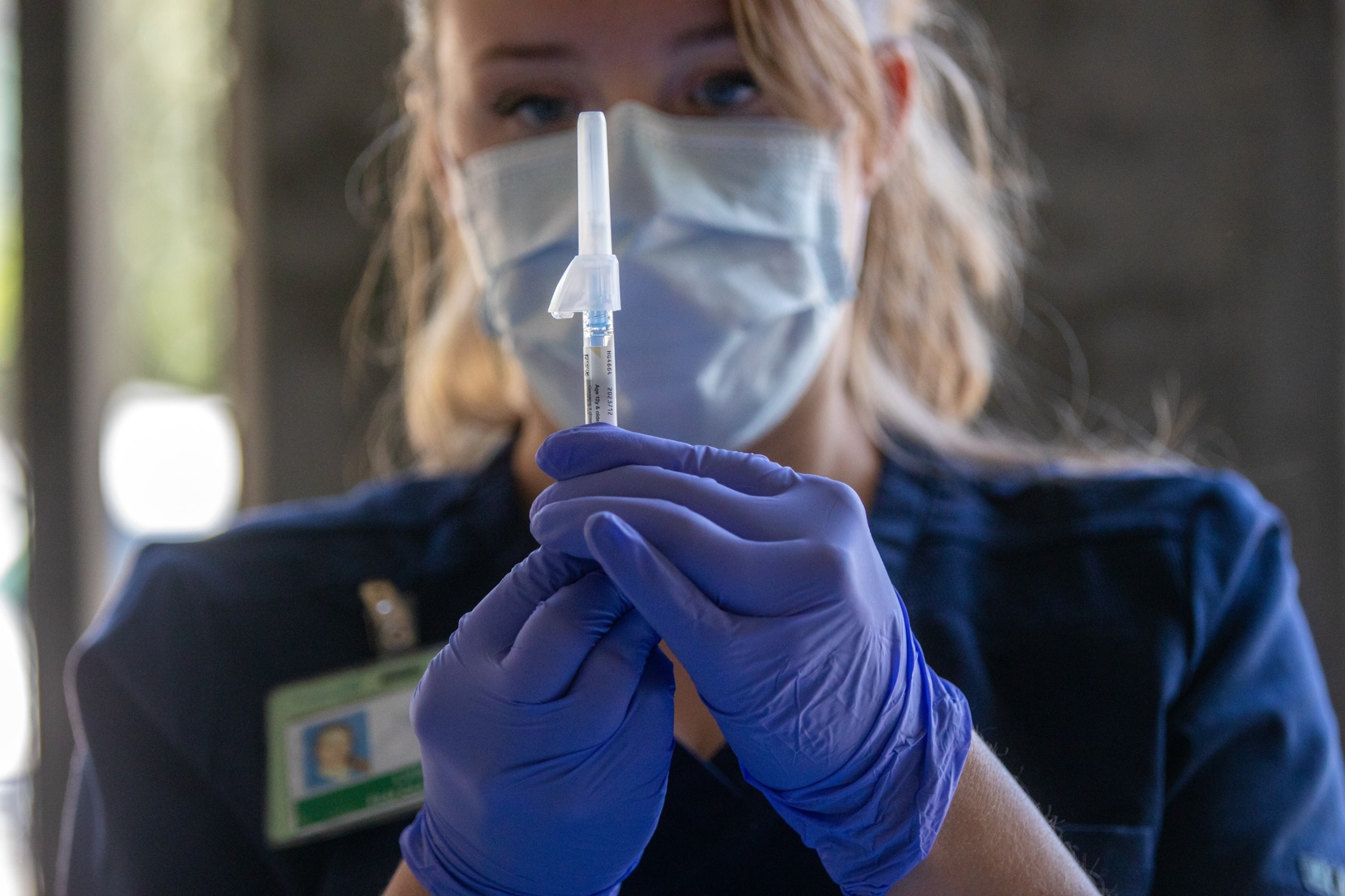 PHOTO: Tracy Gage, LVN, prepares a syringe at a flu and COVID vaccination clinic Kaiser Permanente Pasadena, Oct. 12, 2023, in Pasadena, CA. 