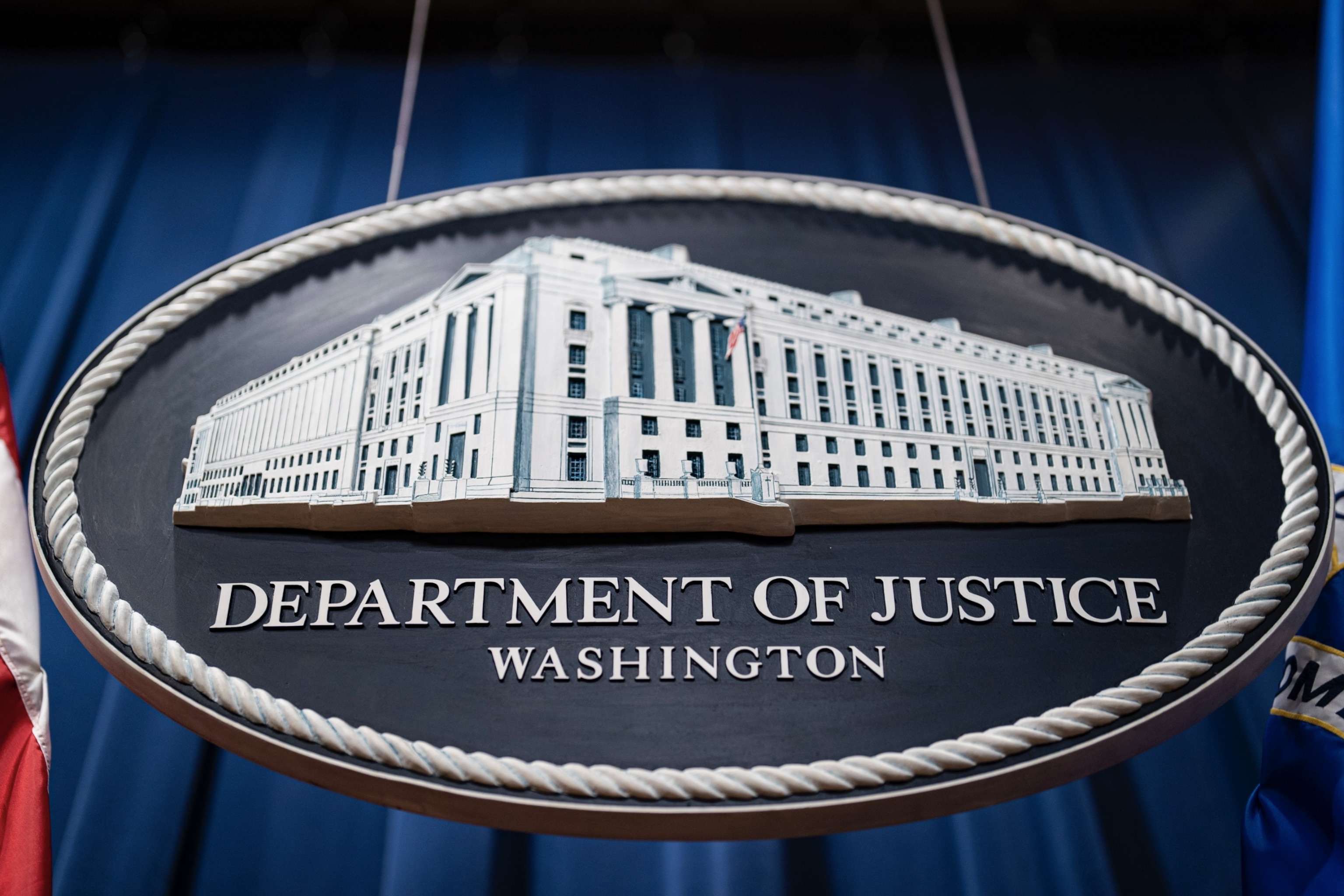 PHOTO: Seal of the Department of Justice before a news conference in Washington, D.C., Jan. 24, 2023.