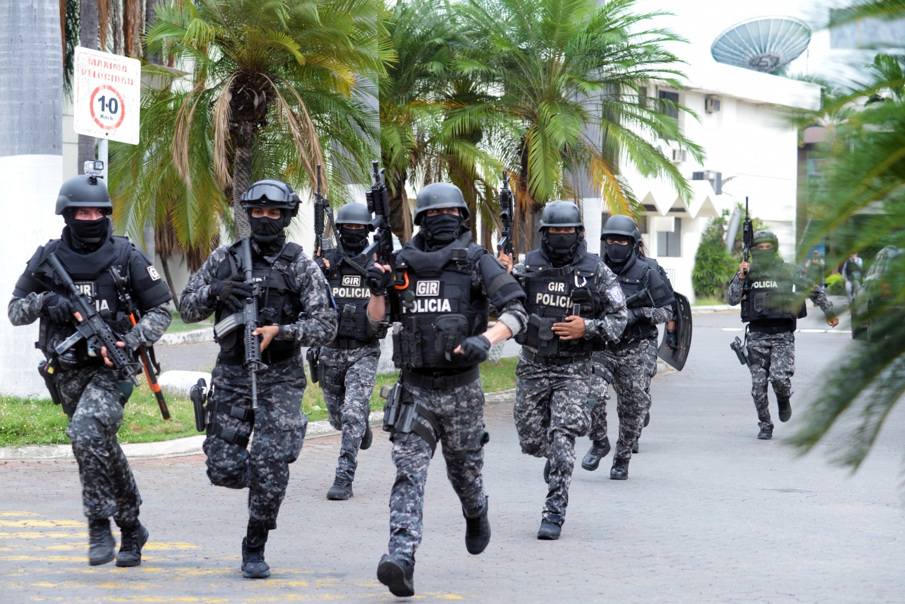 PHOTO: An Ecuadorean police squad enters the premises of Ecuador's TC television channel after unidentified gunmen burst into the state-owned television studio live on air on Jan. 9, 2024, in Guayaquil, Ecuador.