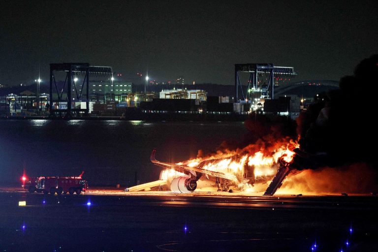 Japan Airlines plane in flames on runway at Tokyo airport; all passengers and crew evacuated