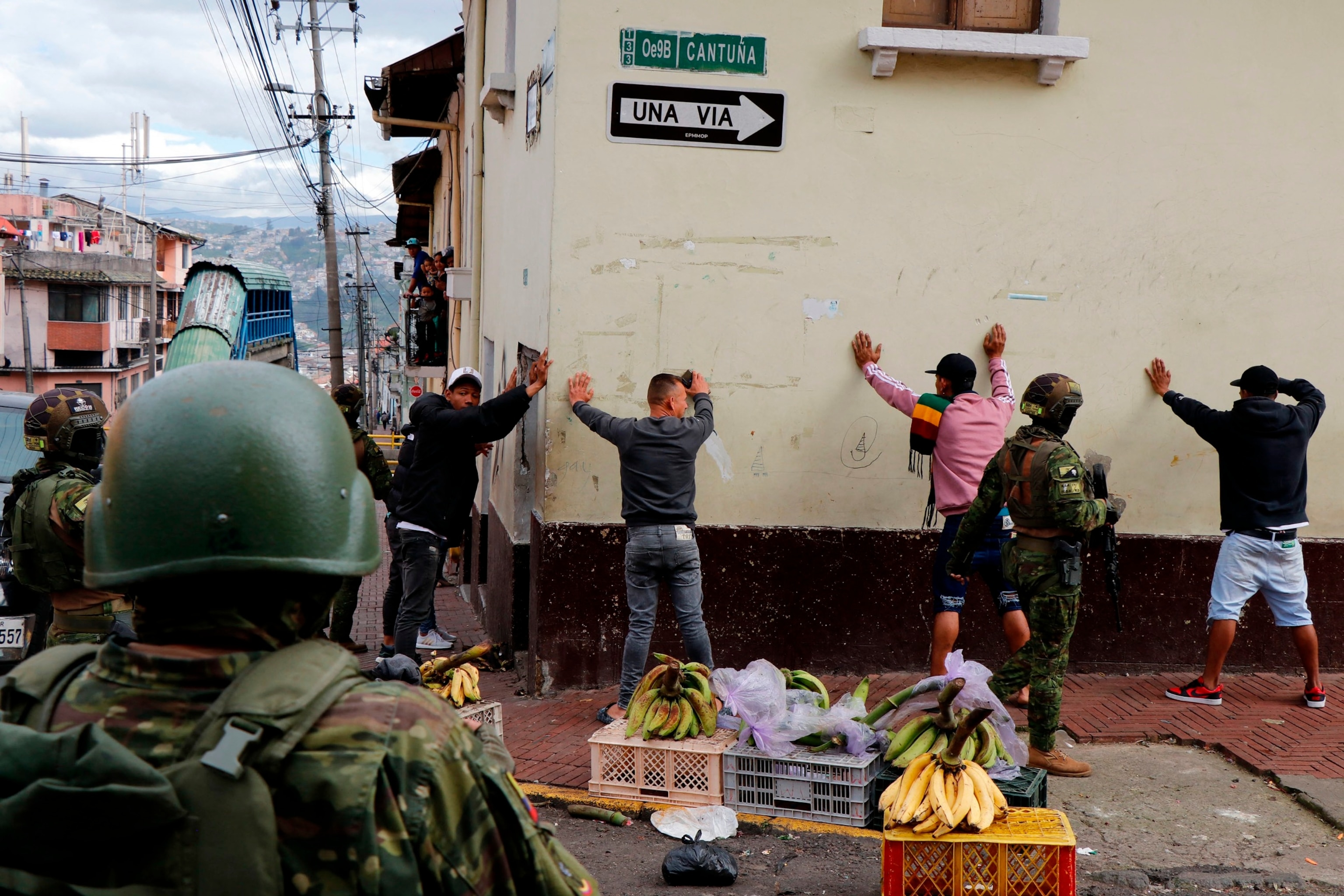 PHOTO: Members of the Armed Forces frisk men during an operation to protect civil security in Quito, on Jan. 10, 2024.