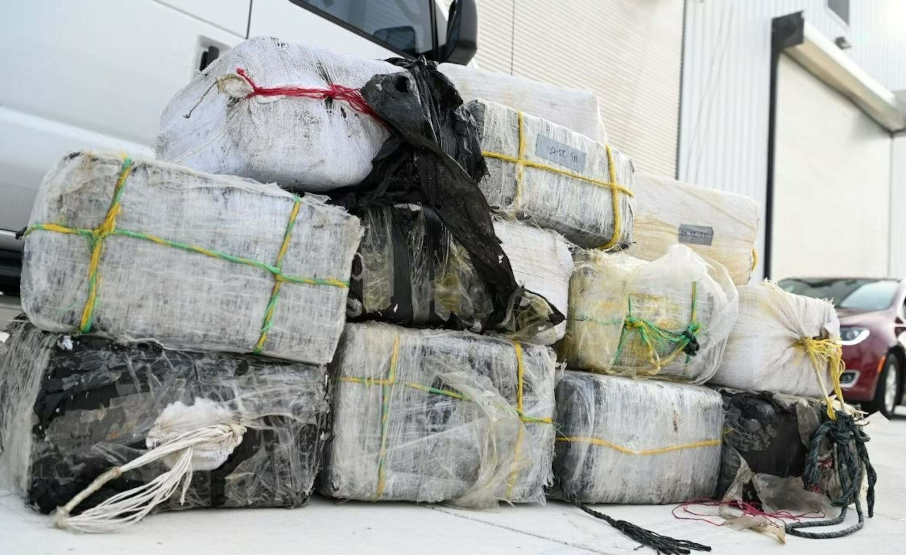 PHOTO: Bales of illicit narcotics are stacked during an offload from Coast Guard Cutter Margaret Norvell at Coast Guard Base Miami, Jan. 9, 2024. The more than 2,450 pounds of drugs are worth an assessed street value of approximately $32.2 million. 